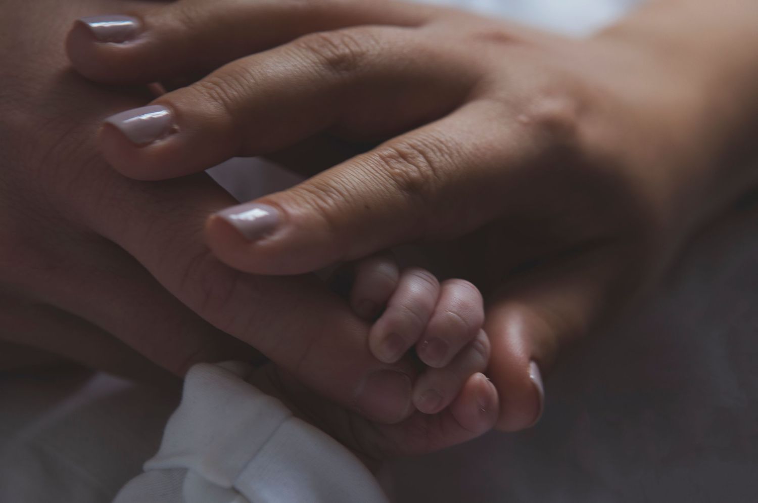 Natural light family photography session in Prestwich, Manchester, with parents and newborn baby