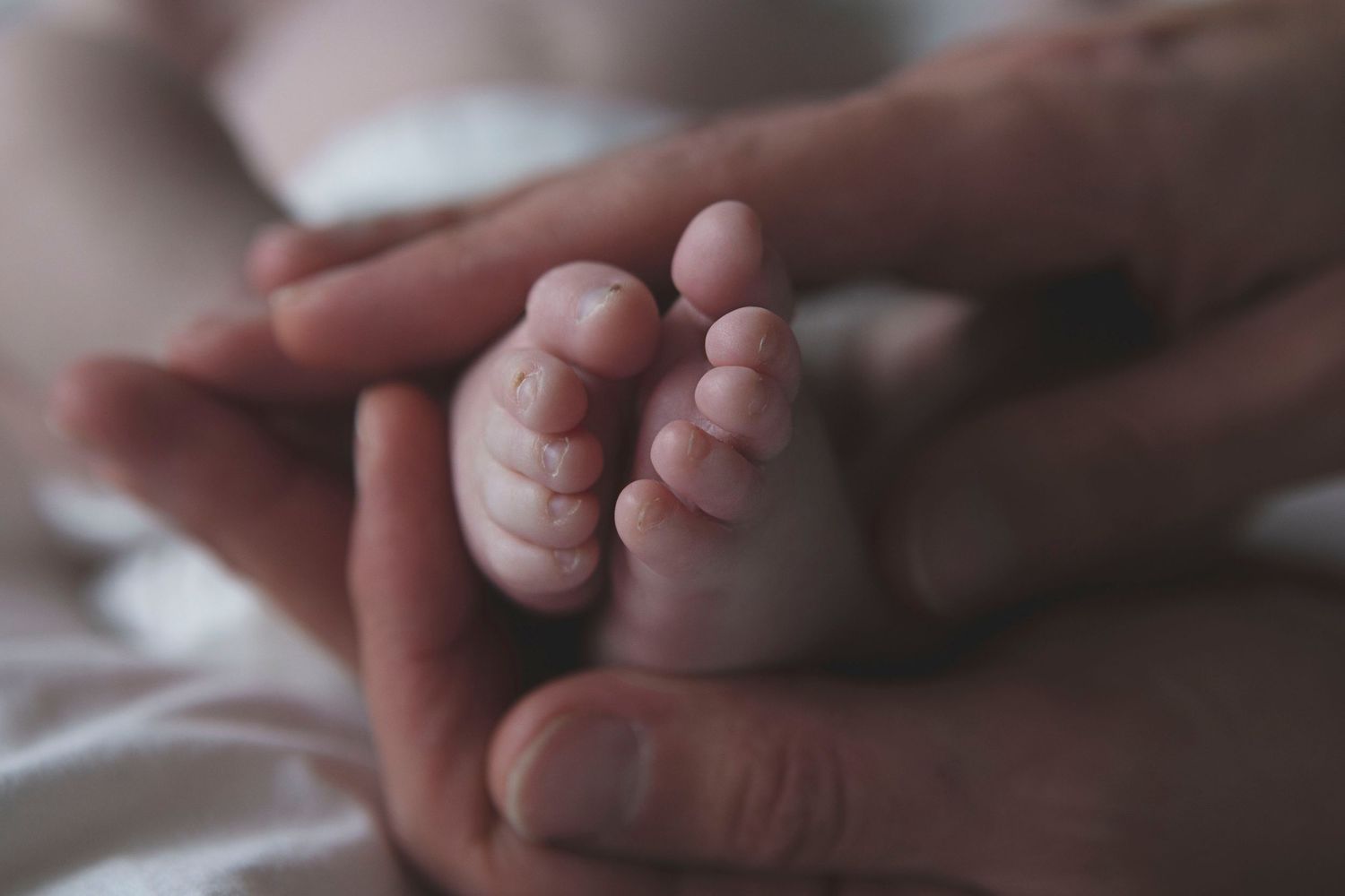 Close-up of a newborn’s tiny feet during newborn shoot in Manchester, UK