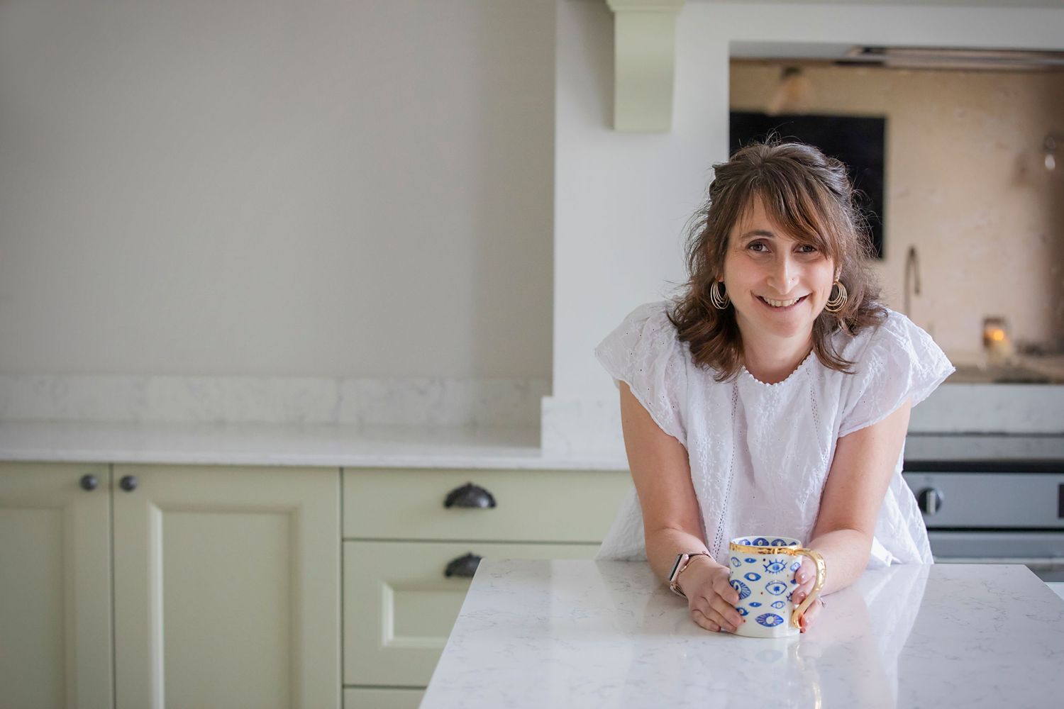 A business professional poses for a branding shoot in her home in Prestwich, Manchester.
