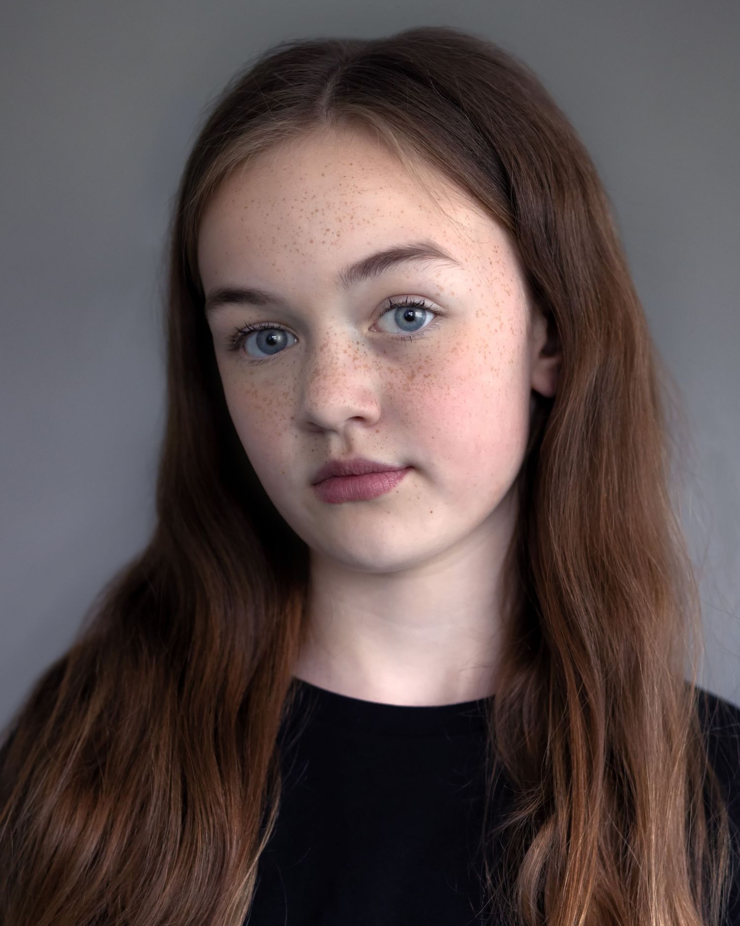 A young girl in Manchester captured in an acting headshot, showcasing confidence during a professional headshot session