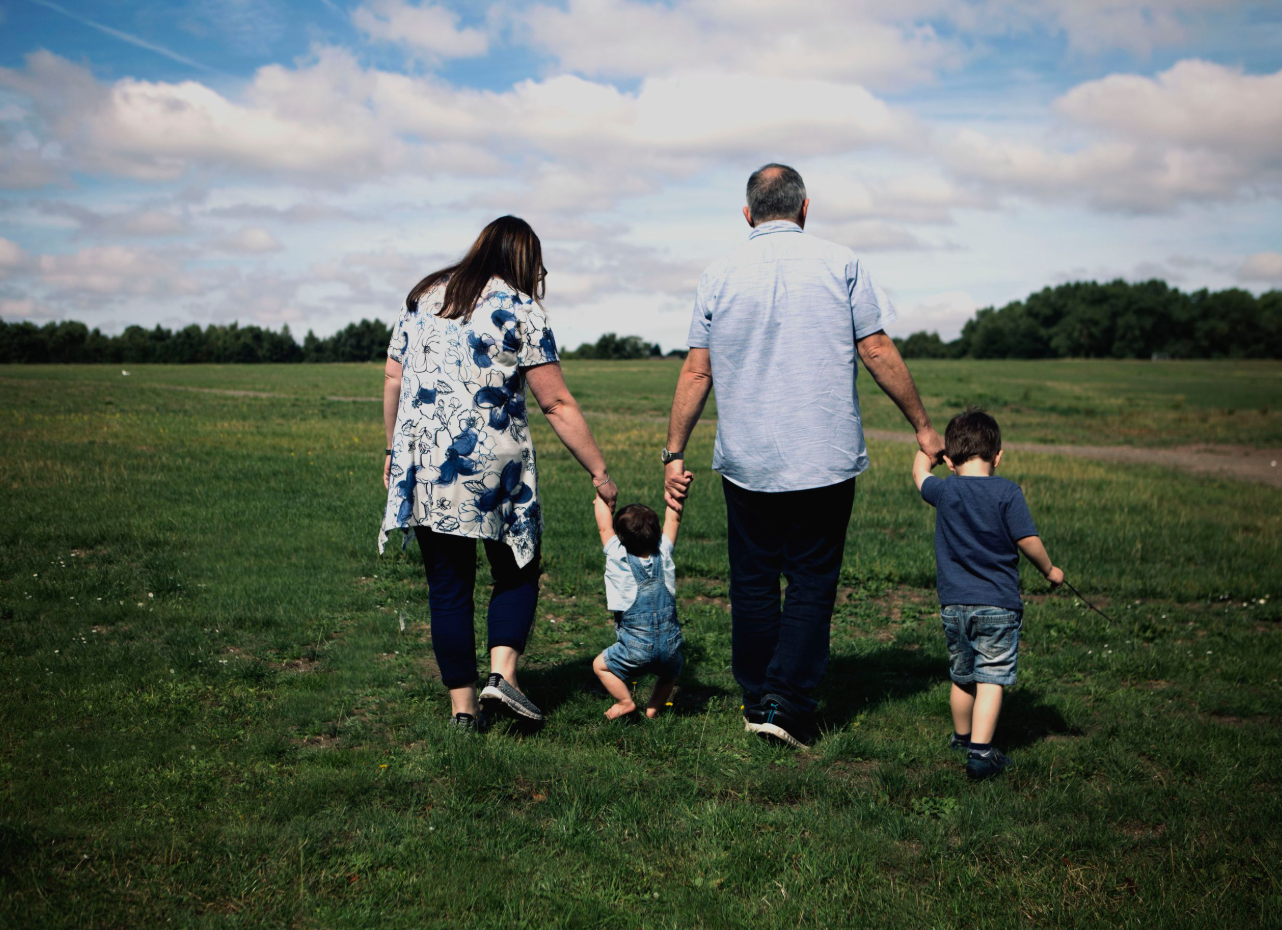 Professional family photography session in Whitefield, Manchester with a playful family of four