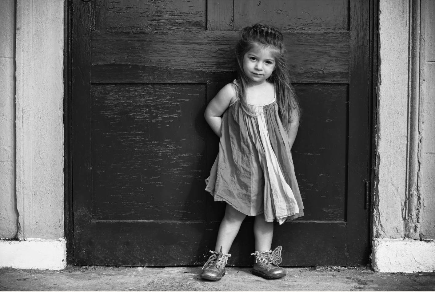 Black and white portrait of a girl posing during her photo shoot at a local park in Manchester, UK