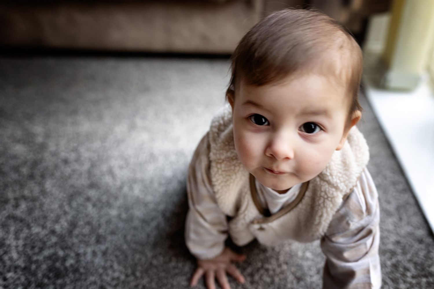 Manchester newborn and family photographer captures a sweet baby's face as he looks at the camera.