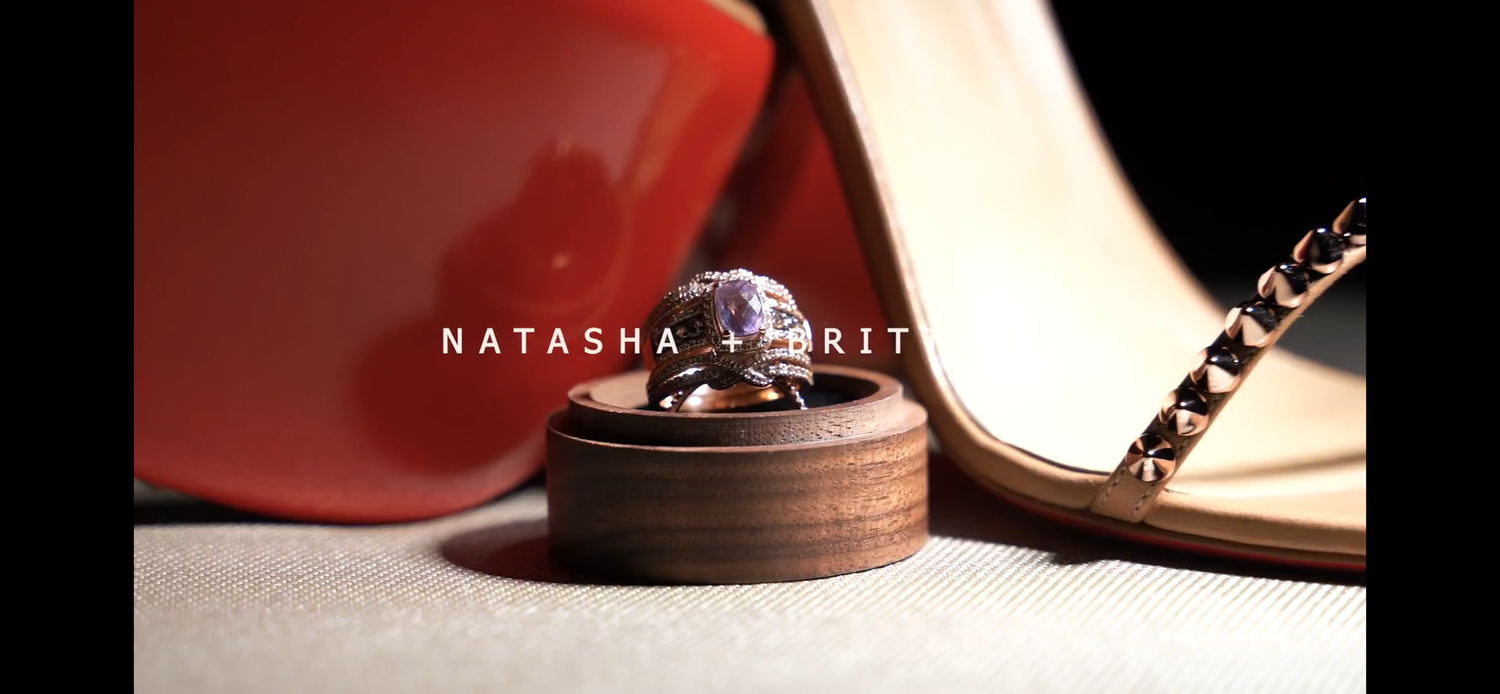 Wedding rings and shoes arranged for an elegant detail photograph.