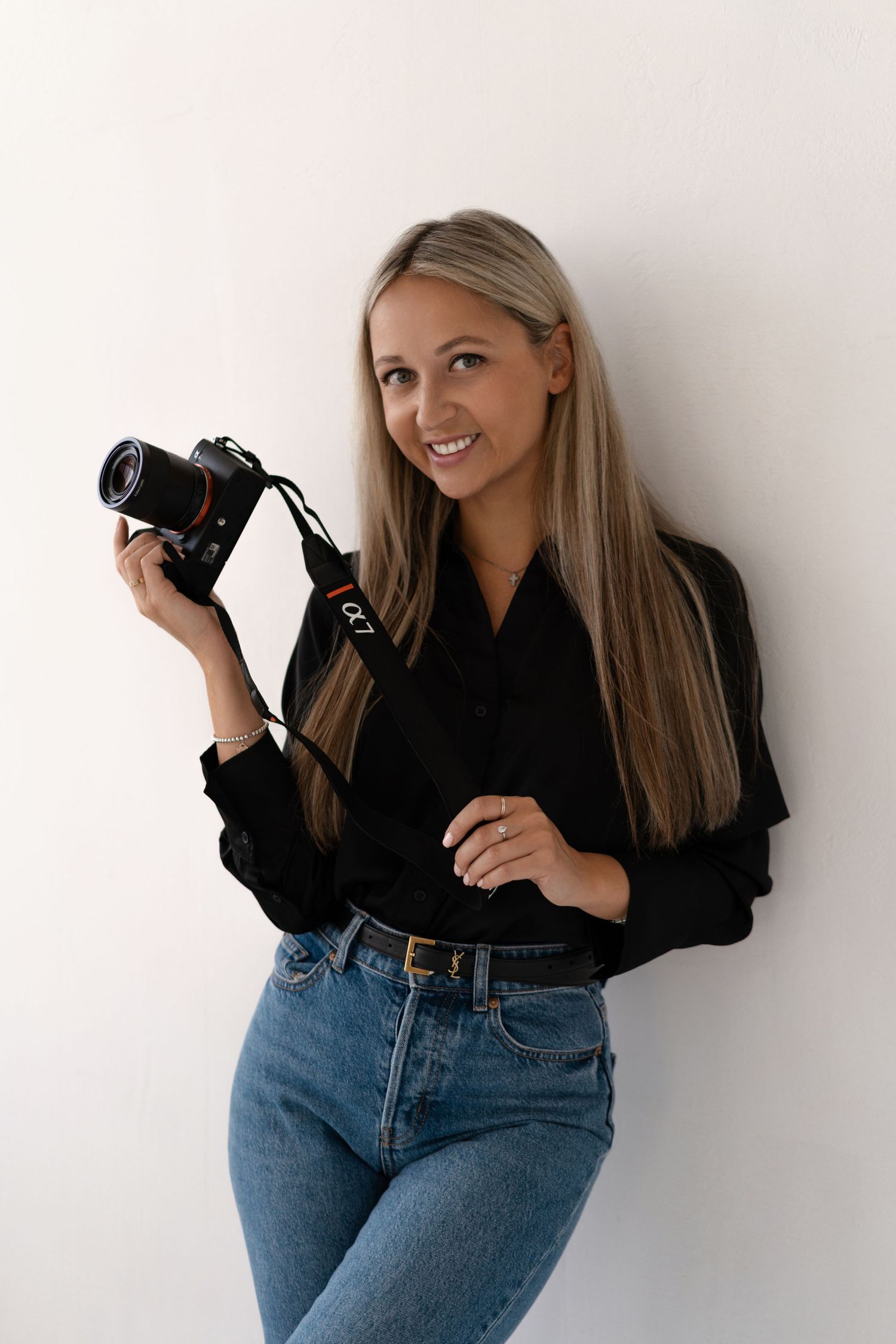 Pregnancy photographer in Chicago posing in her studio.