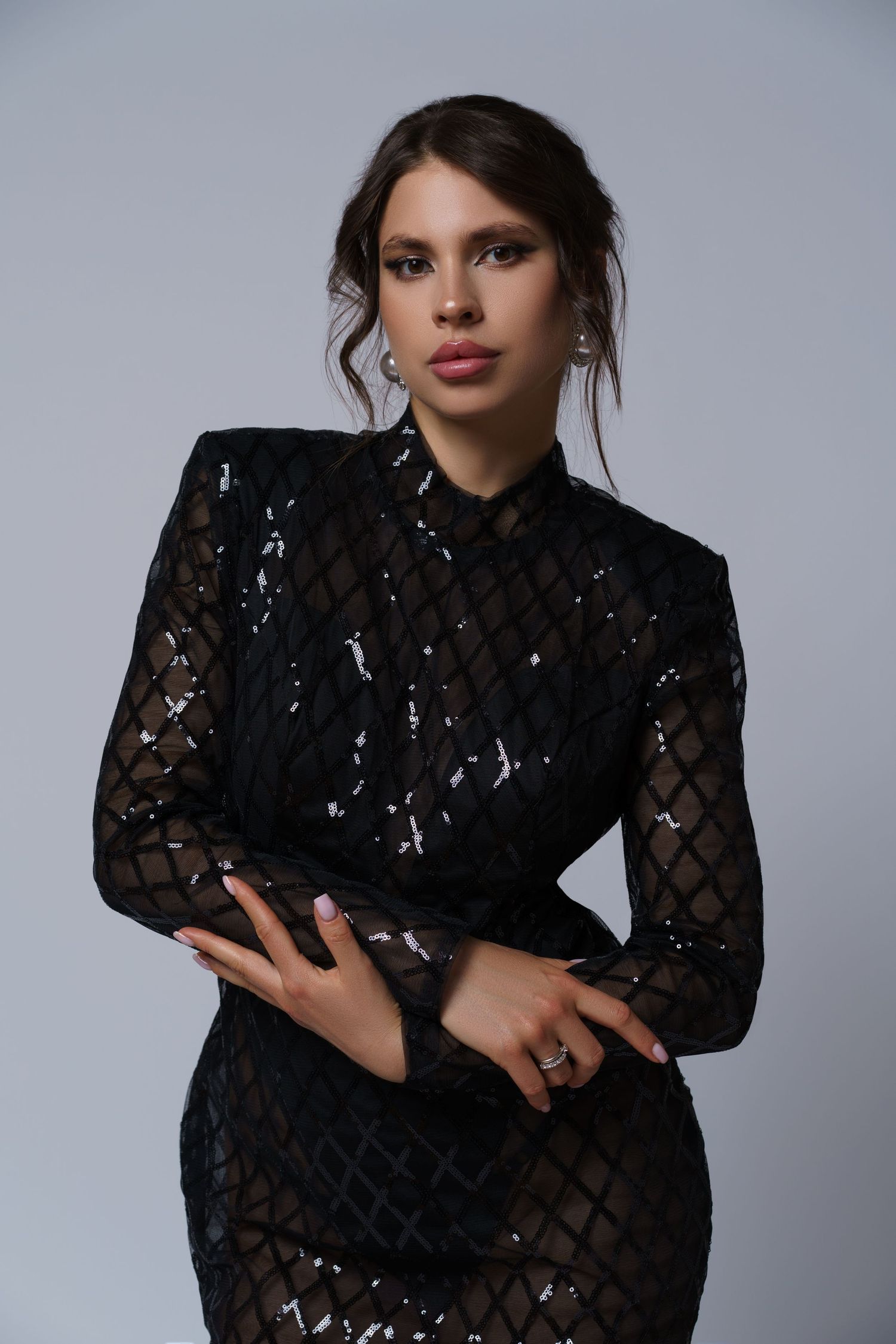 Elegant brunette posing for her birthday photoshoot in a black sequin gown — graceful and refined studio portrait in Chicago.