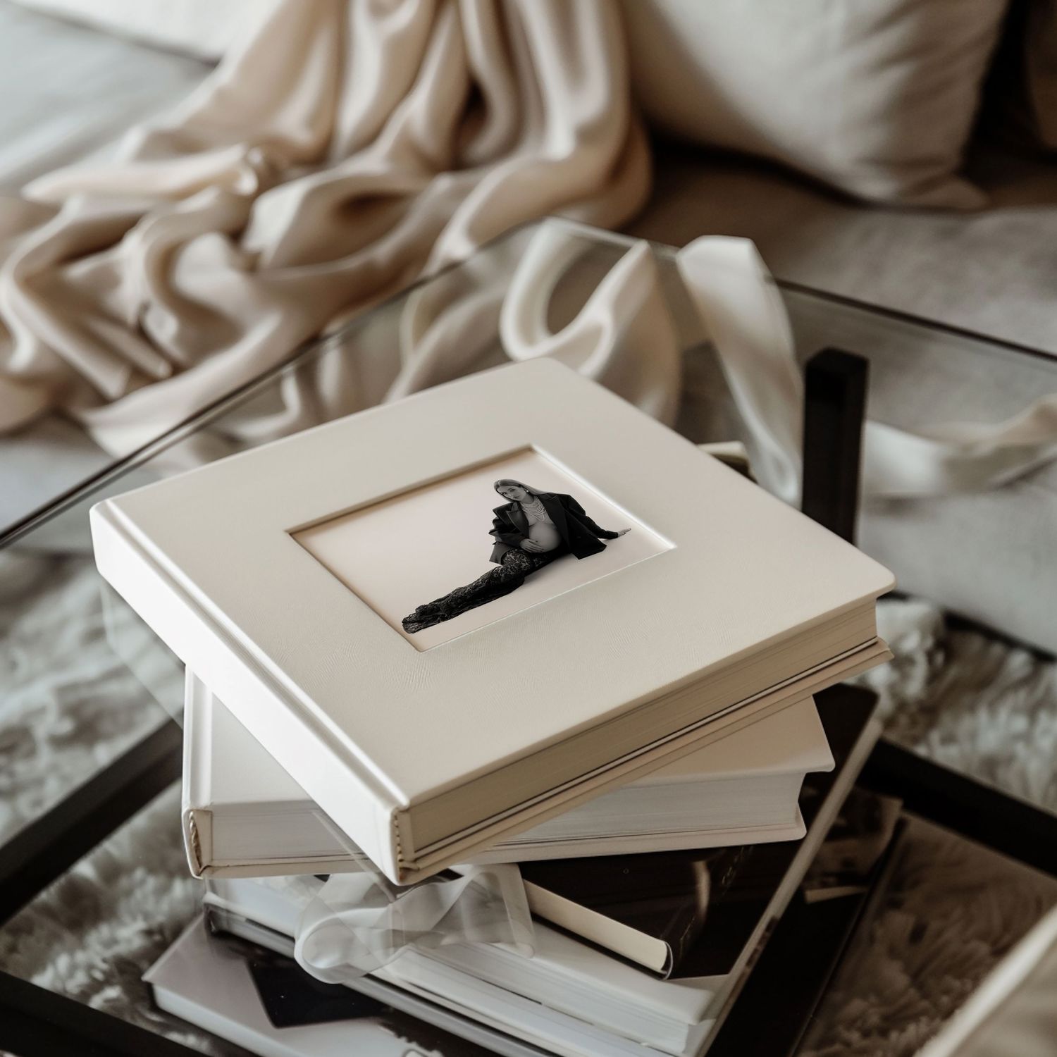 A handcrafted album with maternity pictures placing on coffee table.