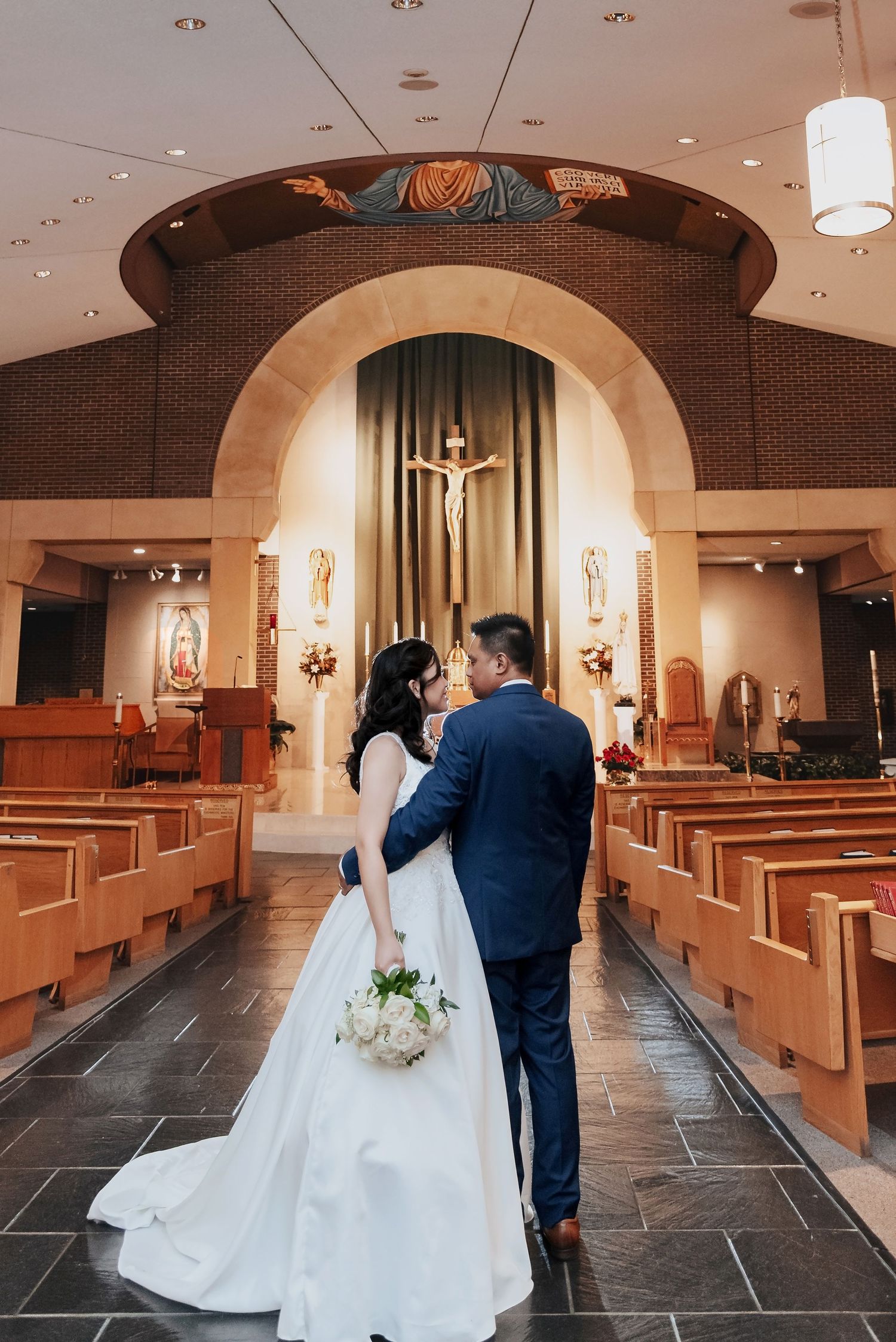 A sequence of elegant church wedding photos shows a couple walking down the stone-floored aisle beneath arched ceilings.