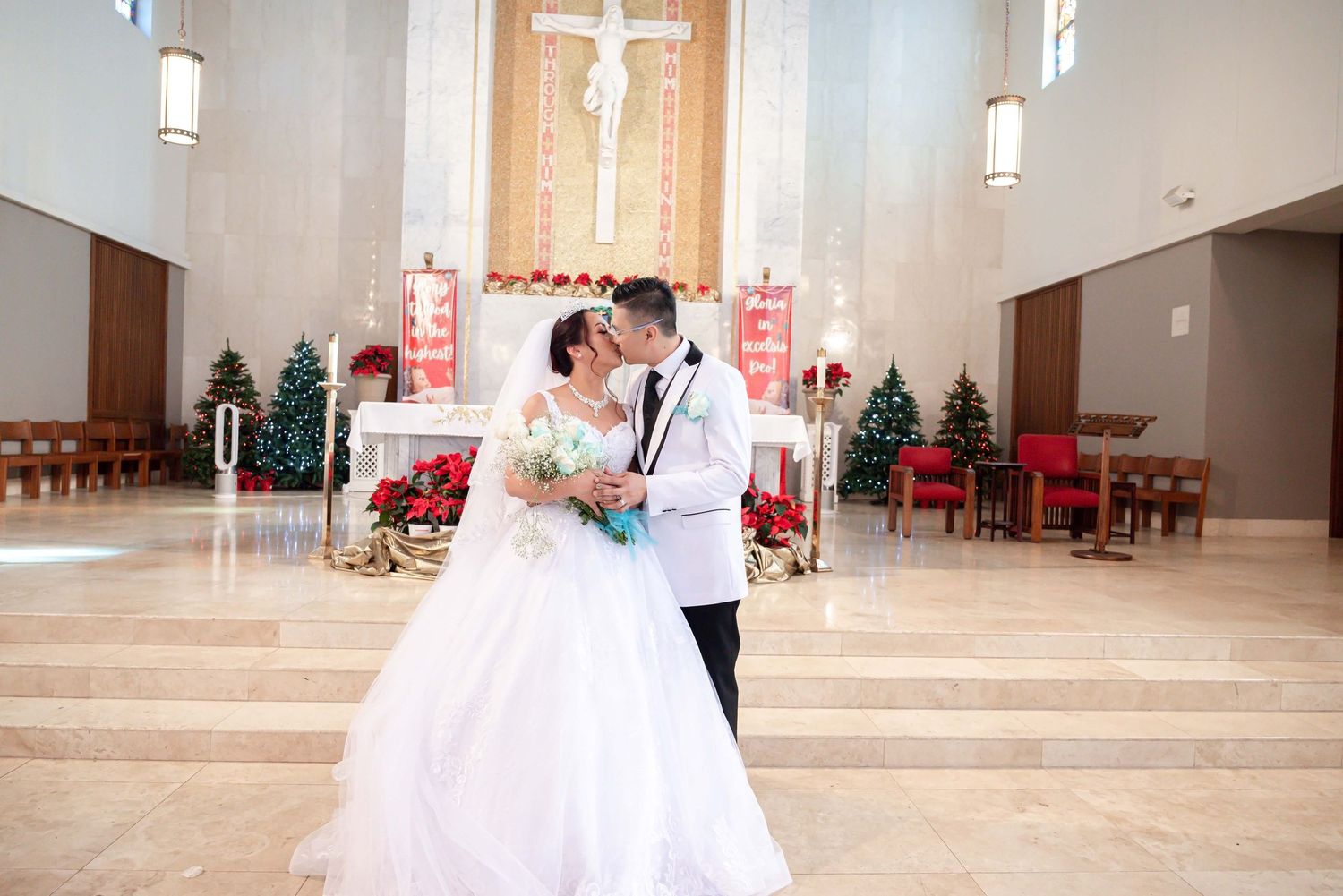 A couple celebrates their wedding ceremony in a modern church with high ceilings and minimalist decor.