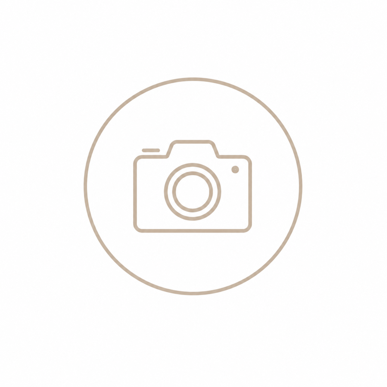 Minimalist camera icon inside a circle, outlined in beige on a white background, representing photo or image placeholder.