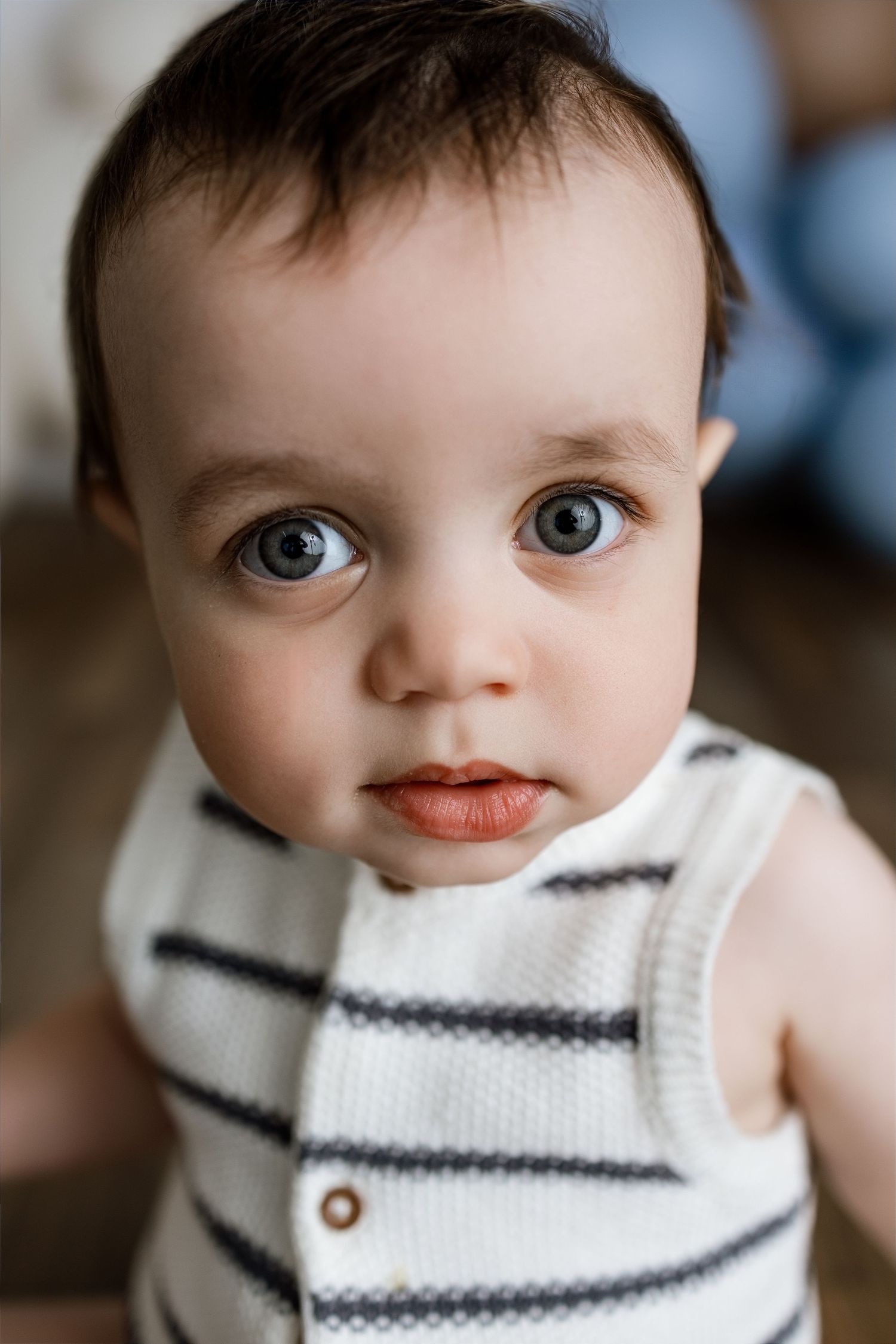 Baby looking up at the camera during a first-birthday milestone photography session at Tara Lee Photography