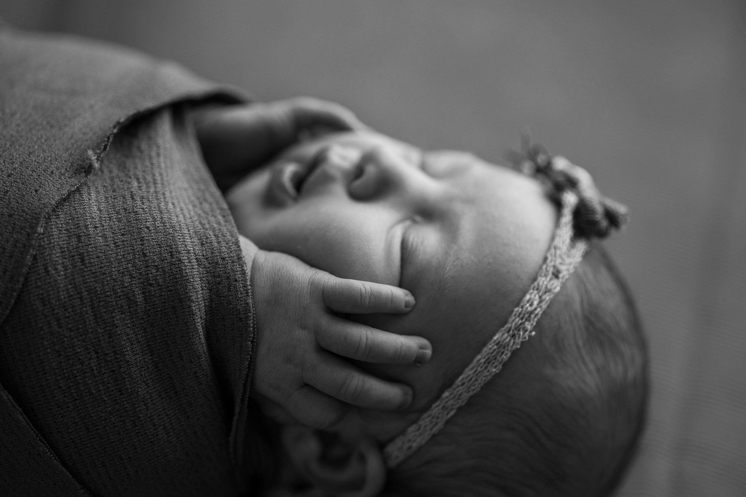 A sequence of intimate black and white photos showing gentle touch and connection between individuals.