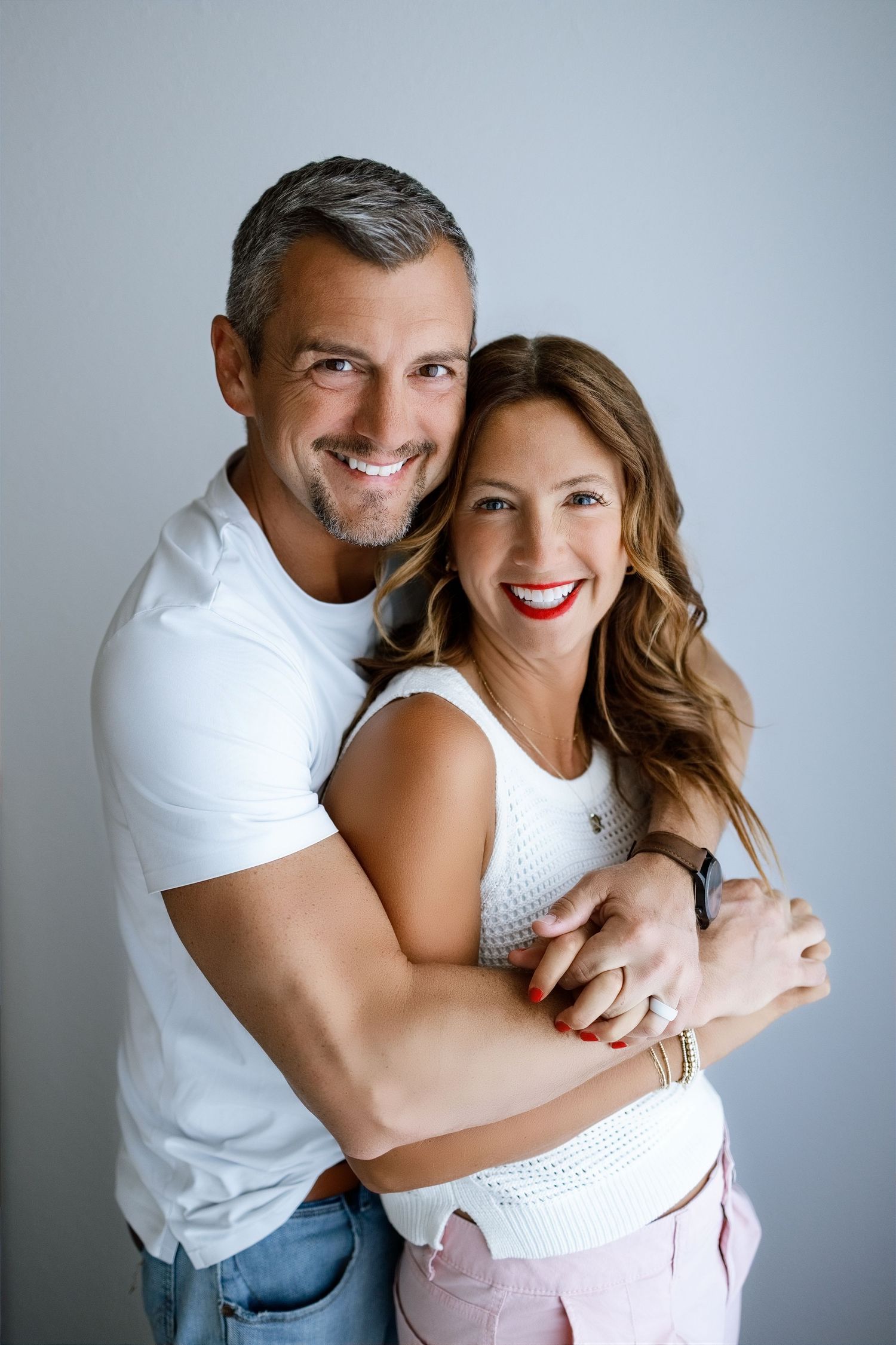 Podcast co-hosts smiling together during a personal-brand photography session at Tara Lee Photography