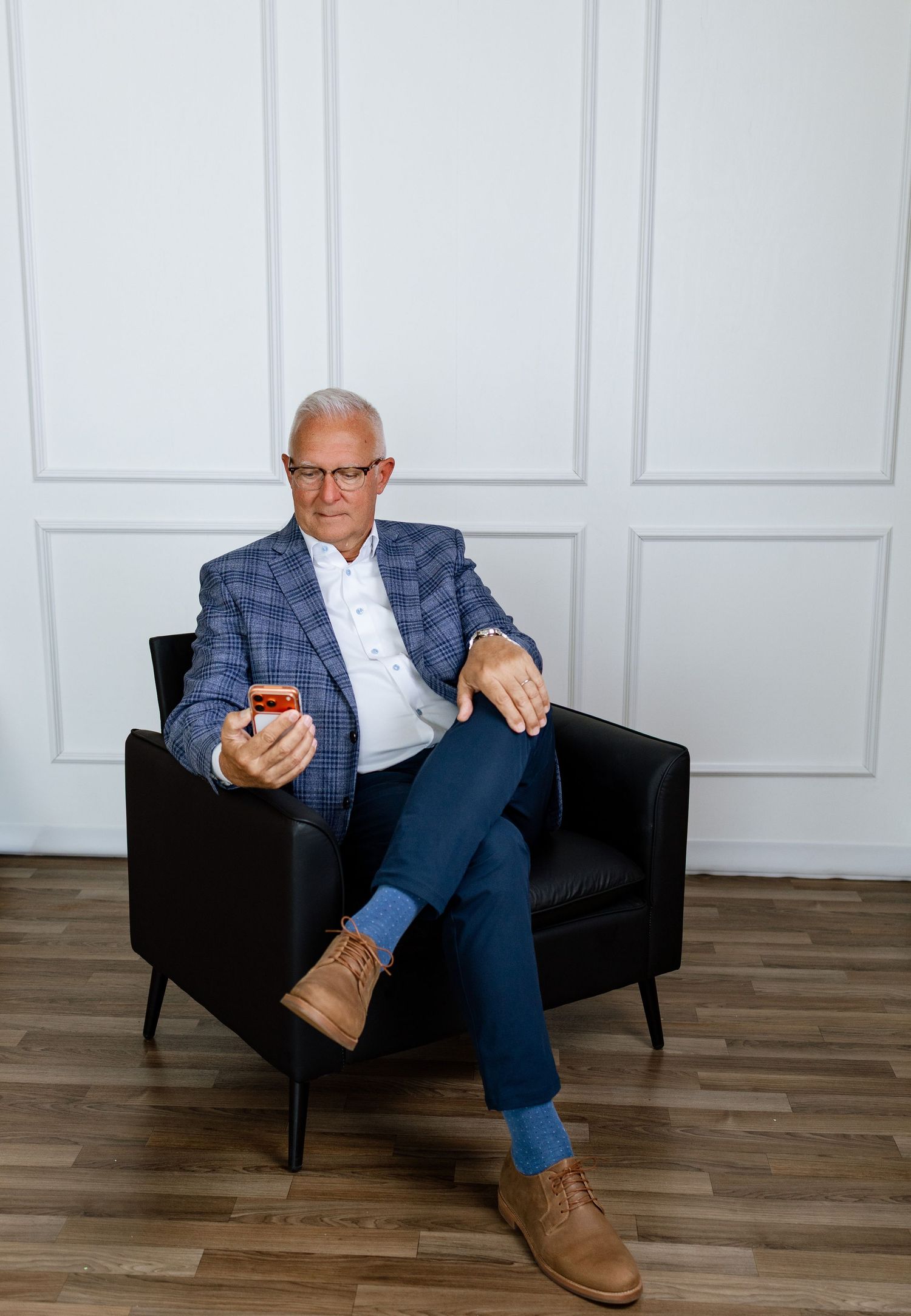 Professional branding portrait of a businessman seated in the Tara Lee Photography studio in Edwardsville