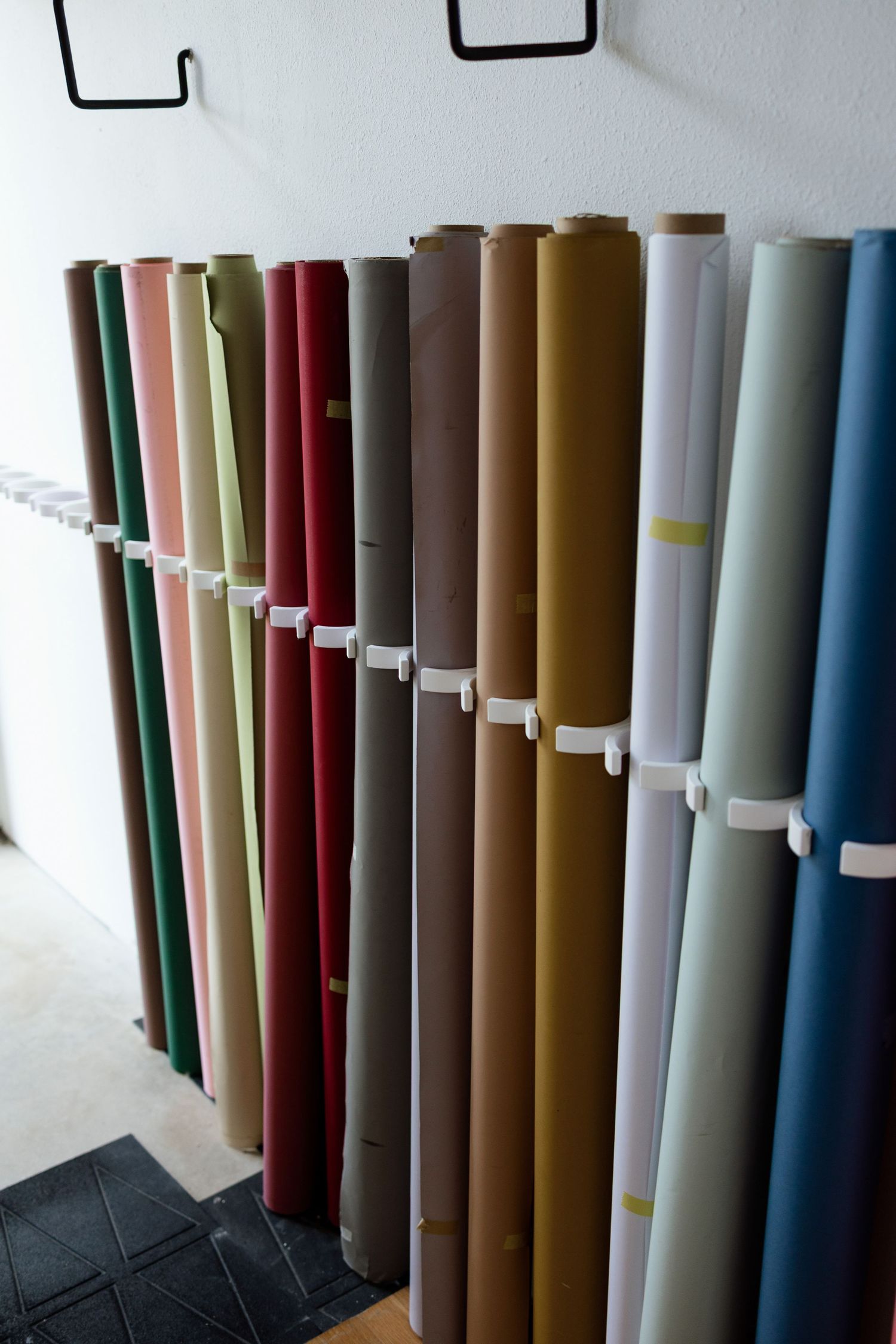 Colorful paper backdrops available for milestone, branding, and studio photography sessions in Edwardsville