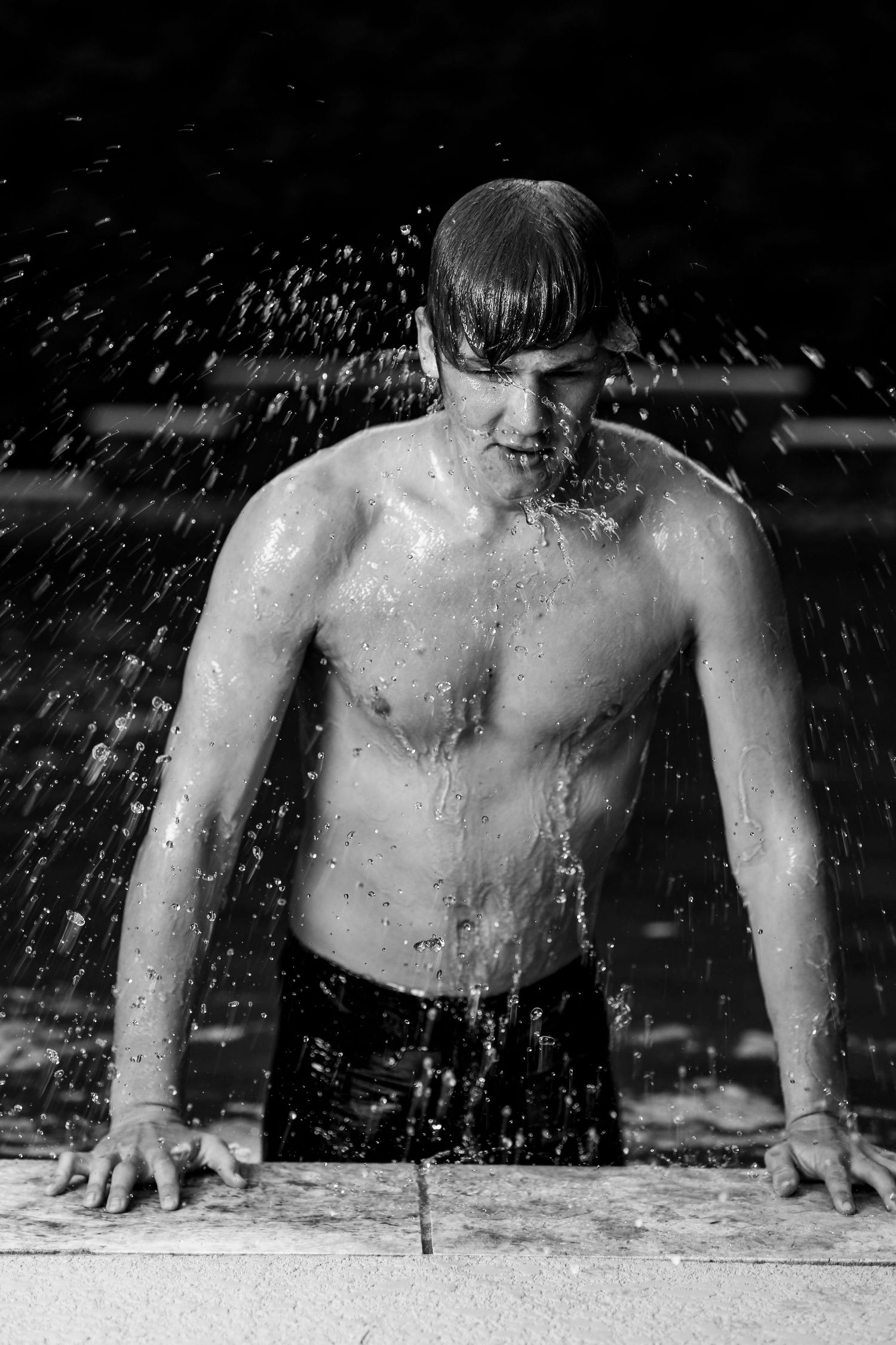 Black and white sequence shows splashing water droplets against a dark background.