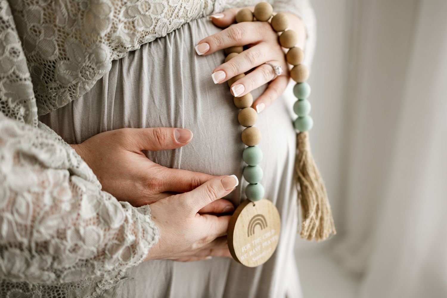 Close-up detail shots of hands holding vintage-style brush and mirror against lace fabric.