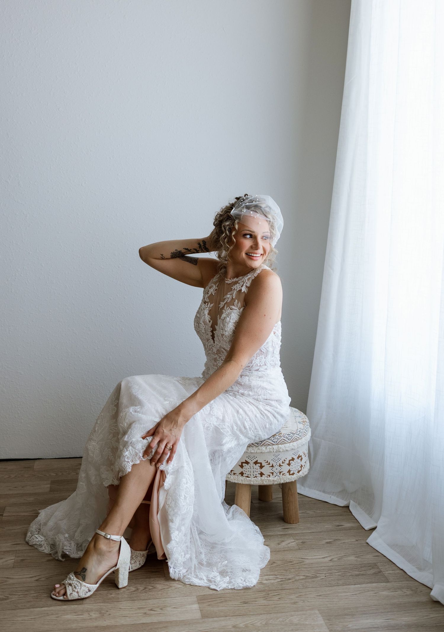 Bride smiling in her wedding dress during a bridal portrait session at Tara Lee Photography’s studio in Edwardsville, Illinois