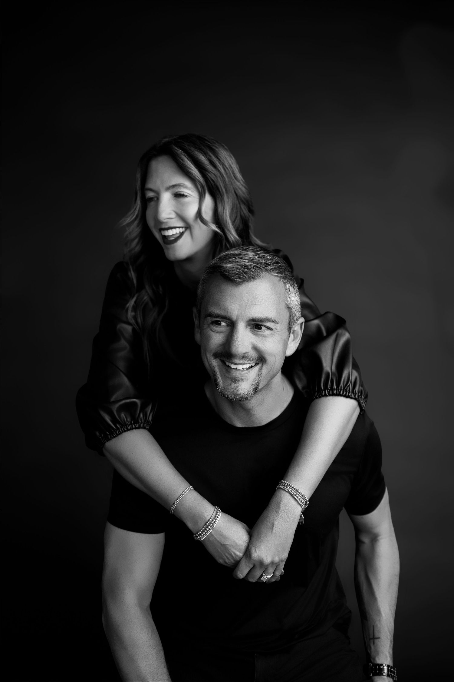 Black-and-white portrait of podcast co-hosts during a creative studio branding photography session