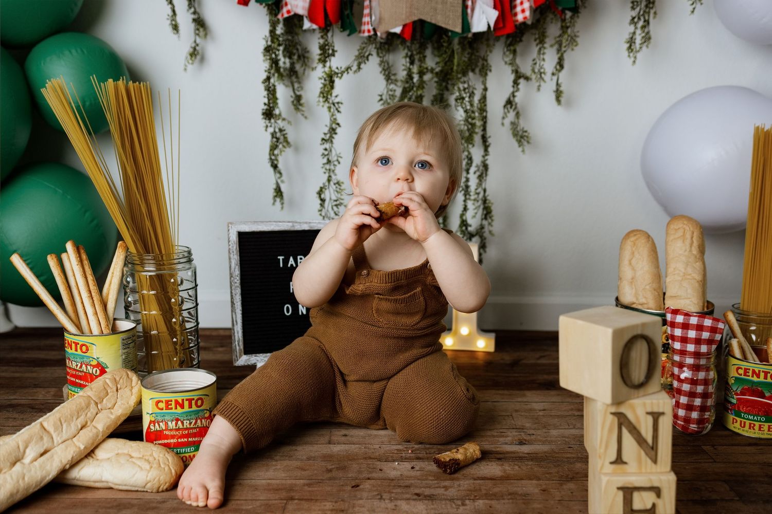 A sequence of photos showing someone eating spaghetti with tomato sauce at a rustic wooden table with greenery decor.