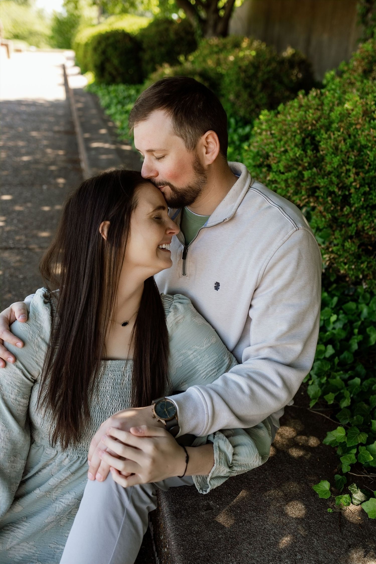 Couple sharing a quiet moment during an outdoor family photography session near Edwardsville