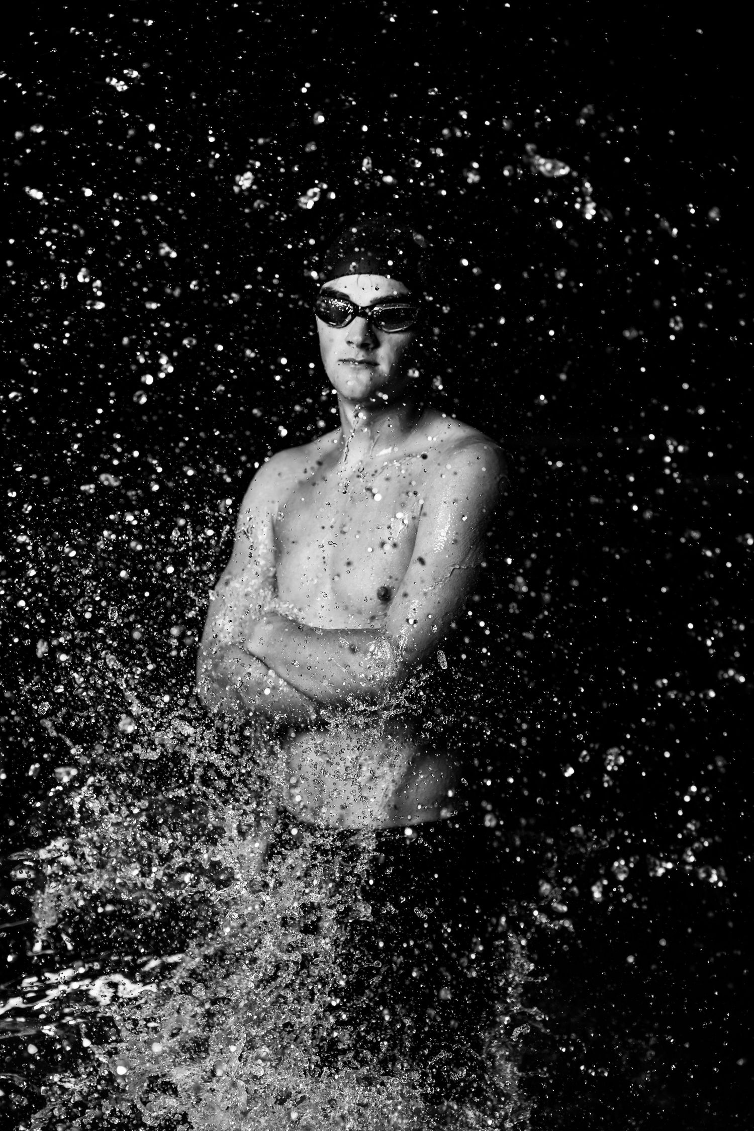 Monochromatic sequence captures water splashing and spraying dramatically in a swimming pool.