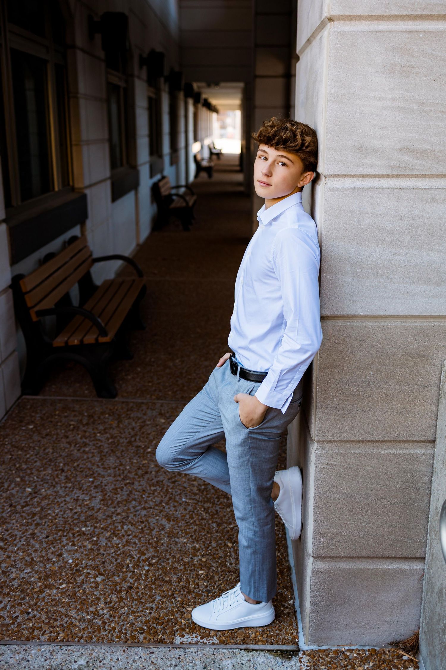 A collection of photos showing someone in a white shirt and jeans leaning against a stone pillar in a covered walkway.