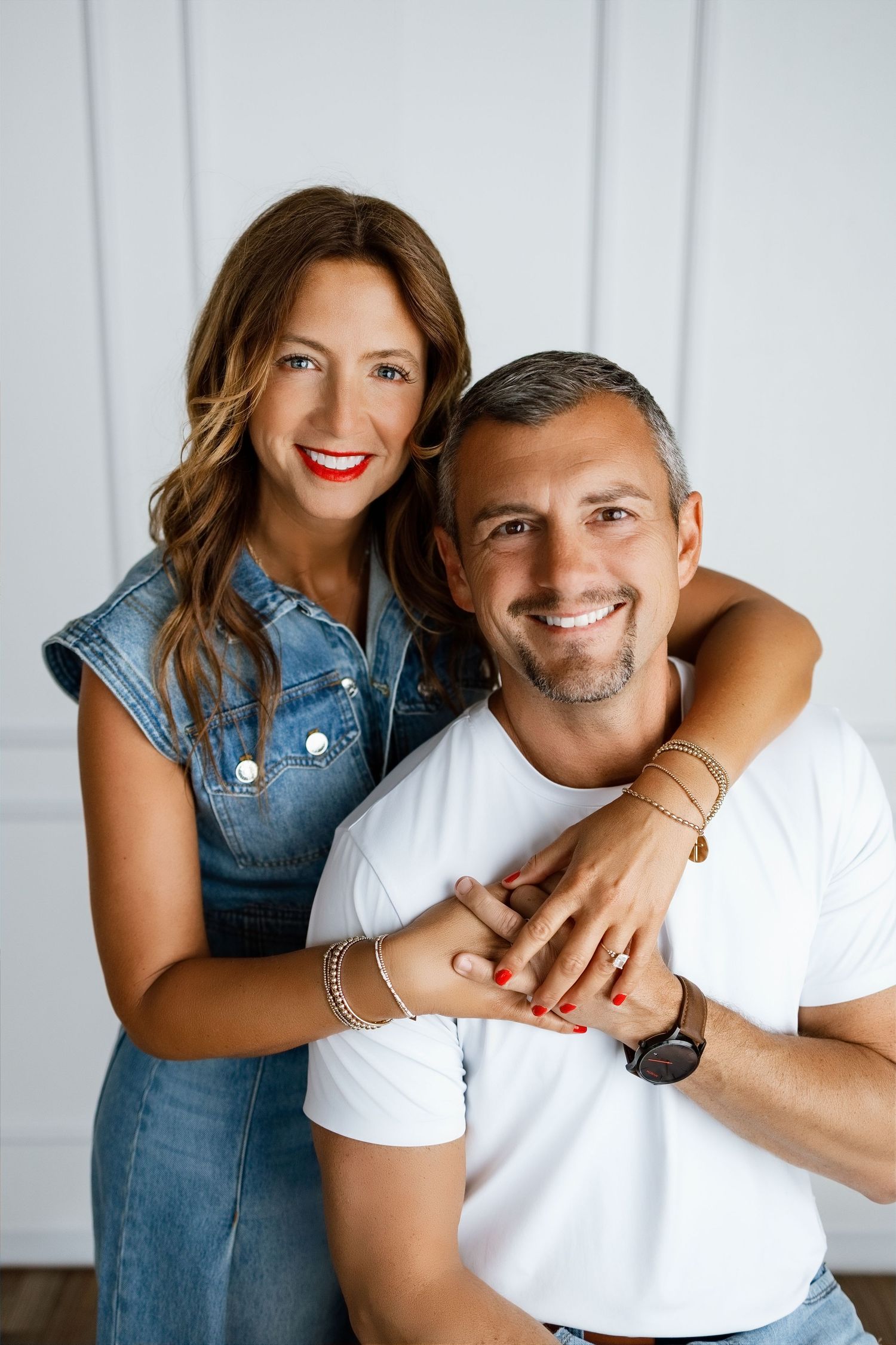 Podcasting couple smiling together during an approachable personal-brand photography session at Tara Lee Photography