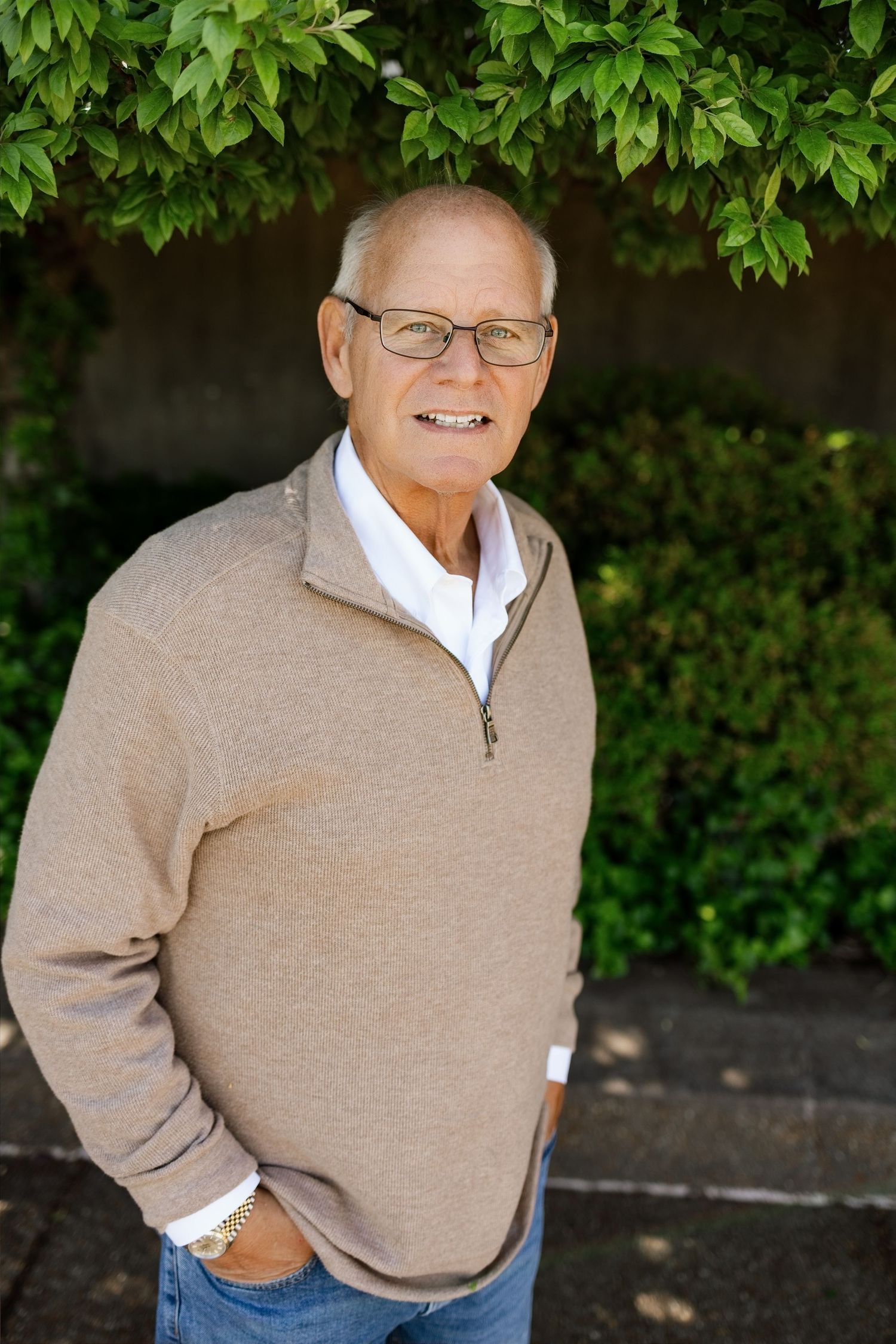 Individual outdoor portrait of a smiling man captured during a family photography session in the Edwardsville area