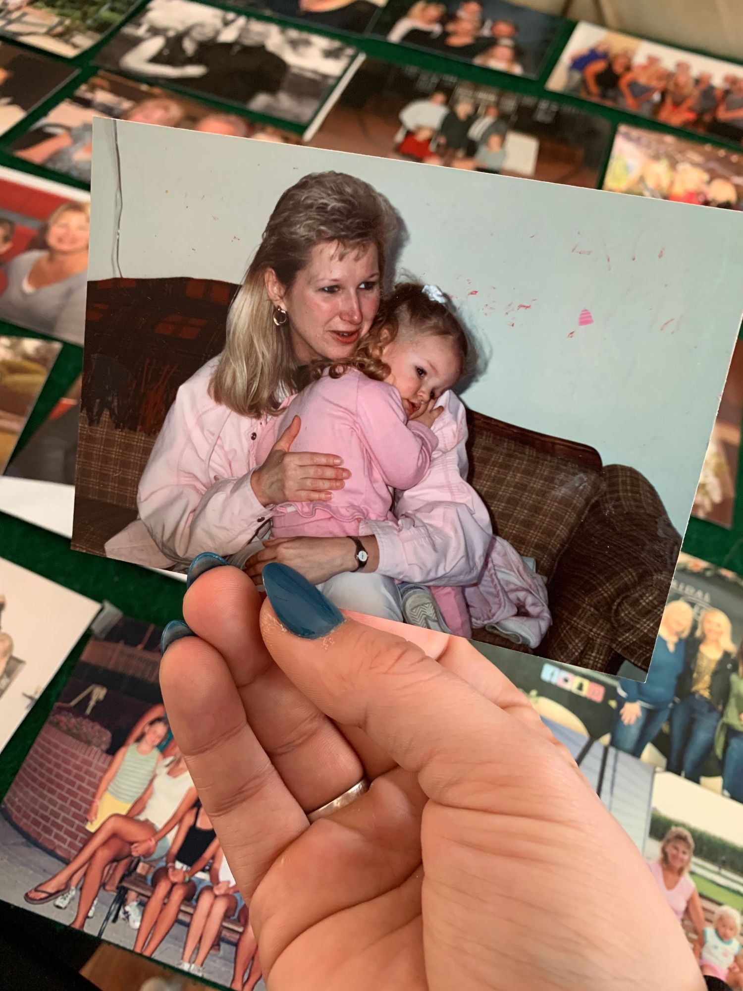 A heartwarming series of photos showing tender family moments with mother and child cuddling on a couch in pink outfits.