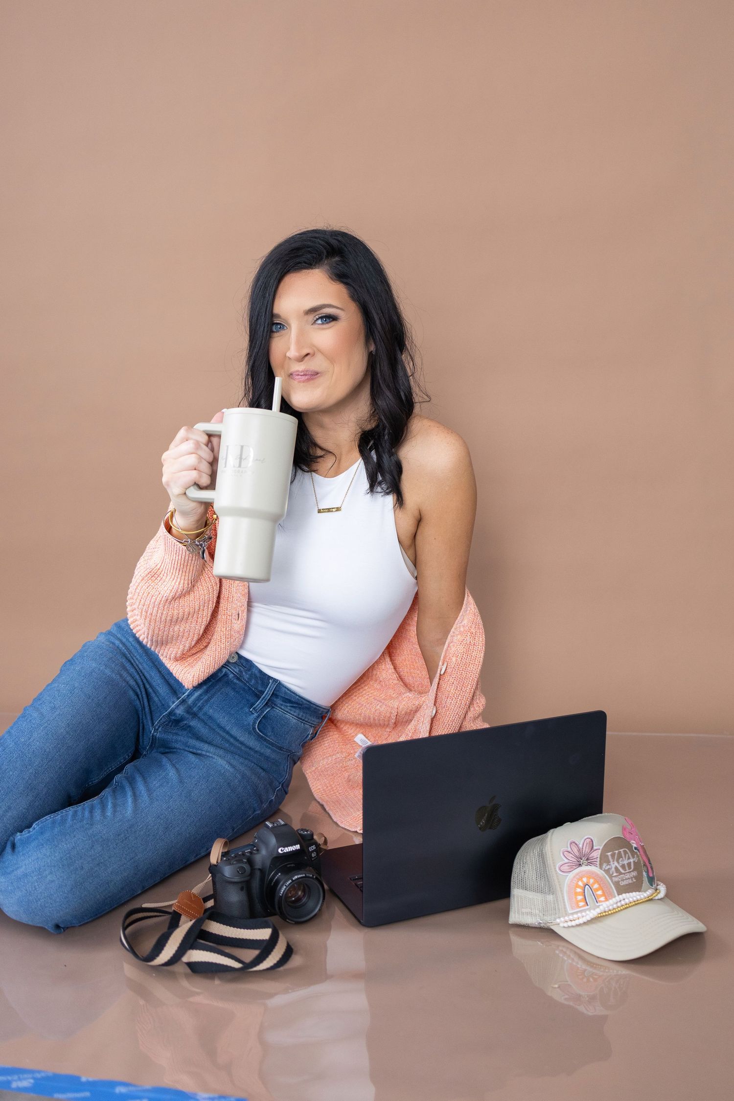 Lifestyle photo of photographer relaxing with coffee and laptop.