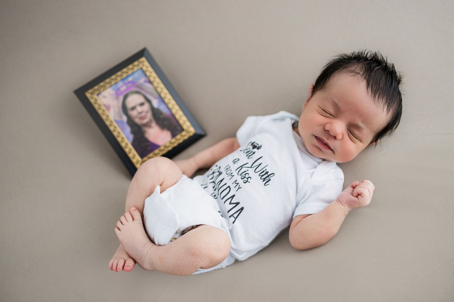 Series of black and white photos showing a peaceful sleeping infant in white clothing on neutral background.