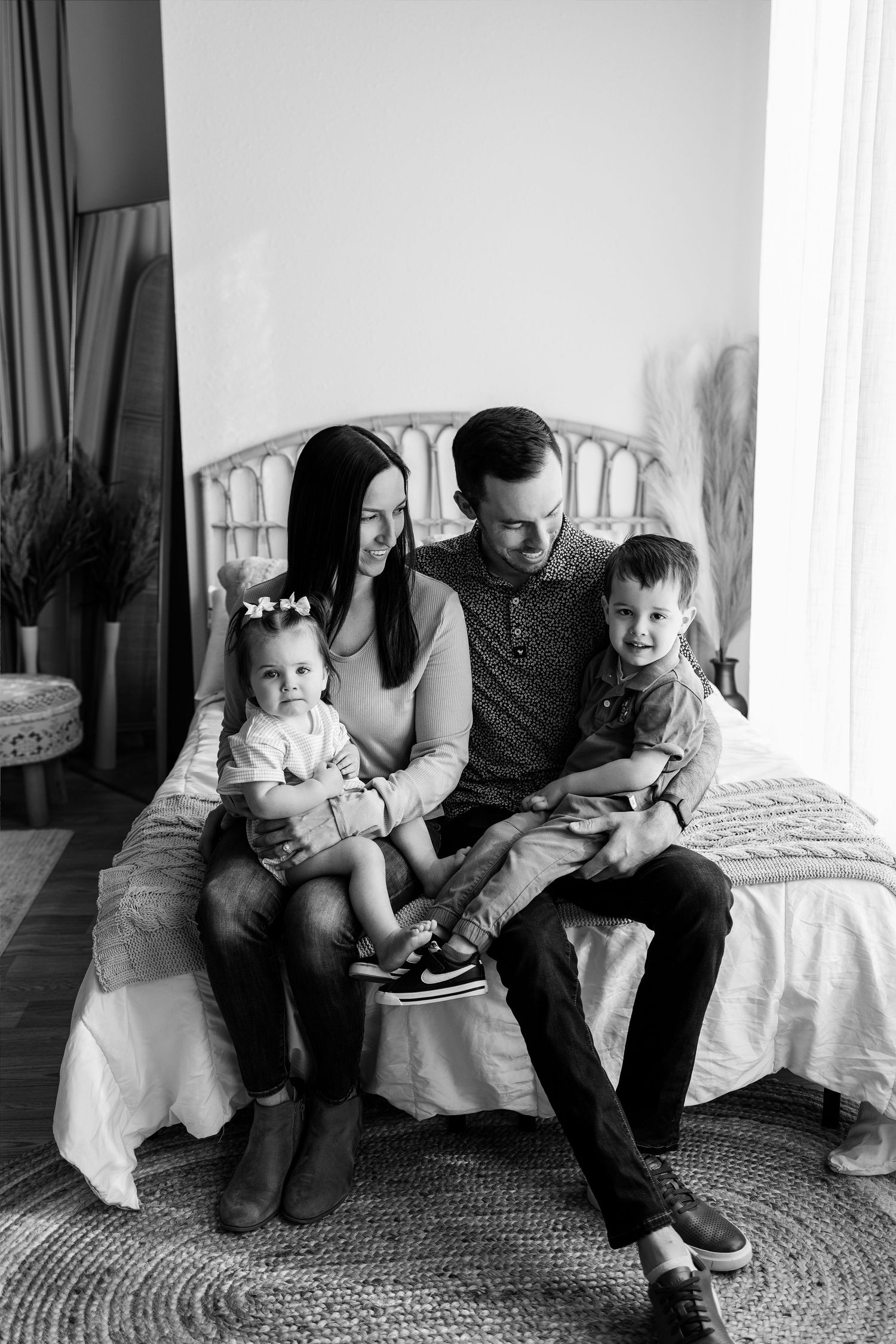 Black-and-white family portrait captured during a first-birthday photography session at Tara Lee Photography