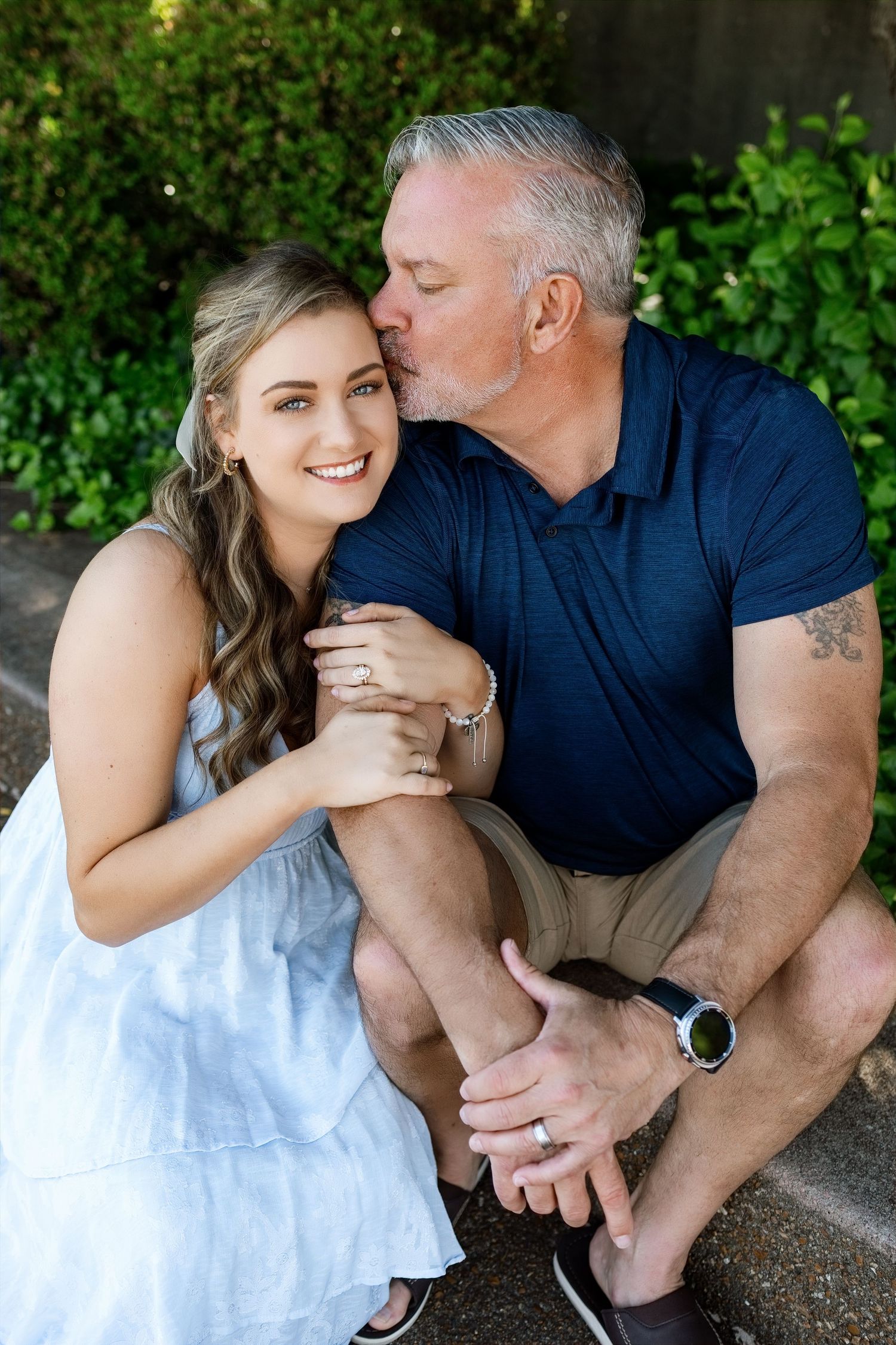 Father and Daughter sharing a caring kiss during a relaxed outdoor family photography session in Southern Illinois