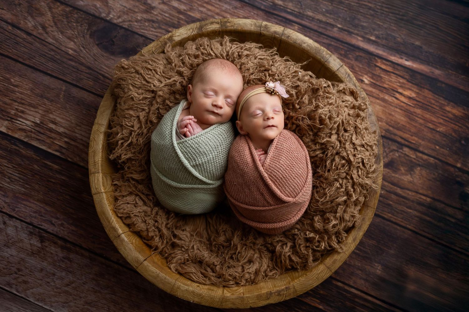 Artistic newborn photography series showing clay-like figures nestled in wooden bowls with brown textured backgrounds.
