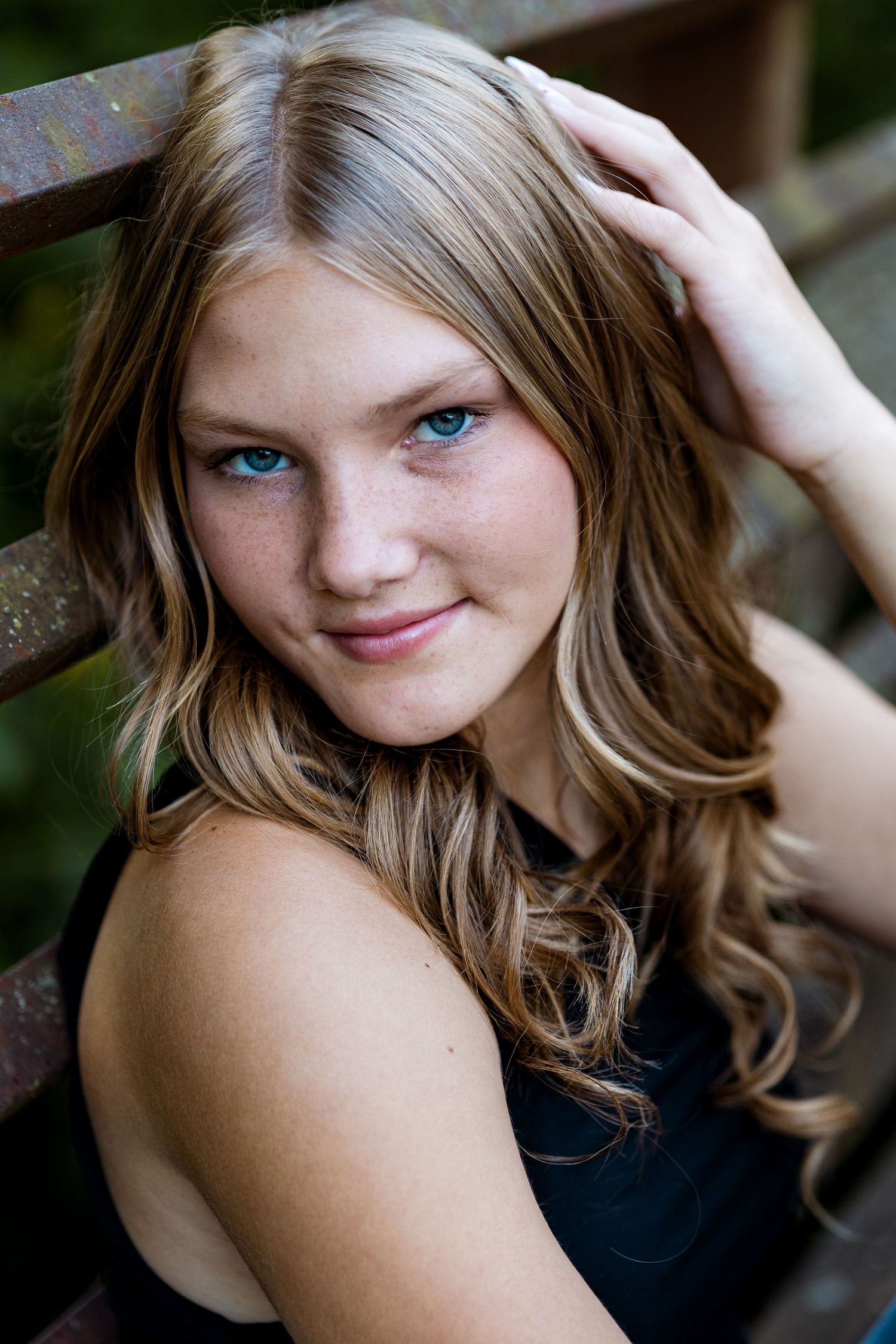 A collection of close-up portrait shots showing wavy hair and natural lighting against a dark background.
