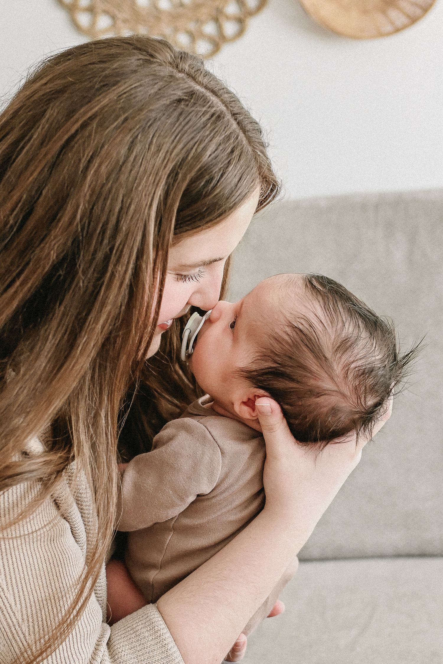 Prince Edward Island photographer captures in-home newborn session with baby and parents.