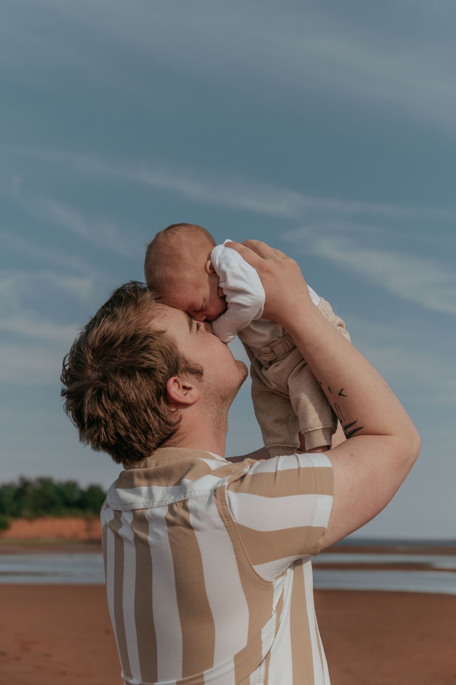 Father and son photo on Prince Edward Island beach.