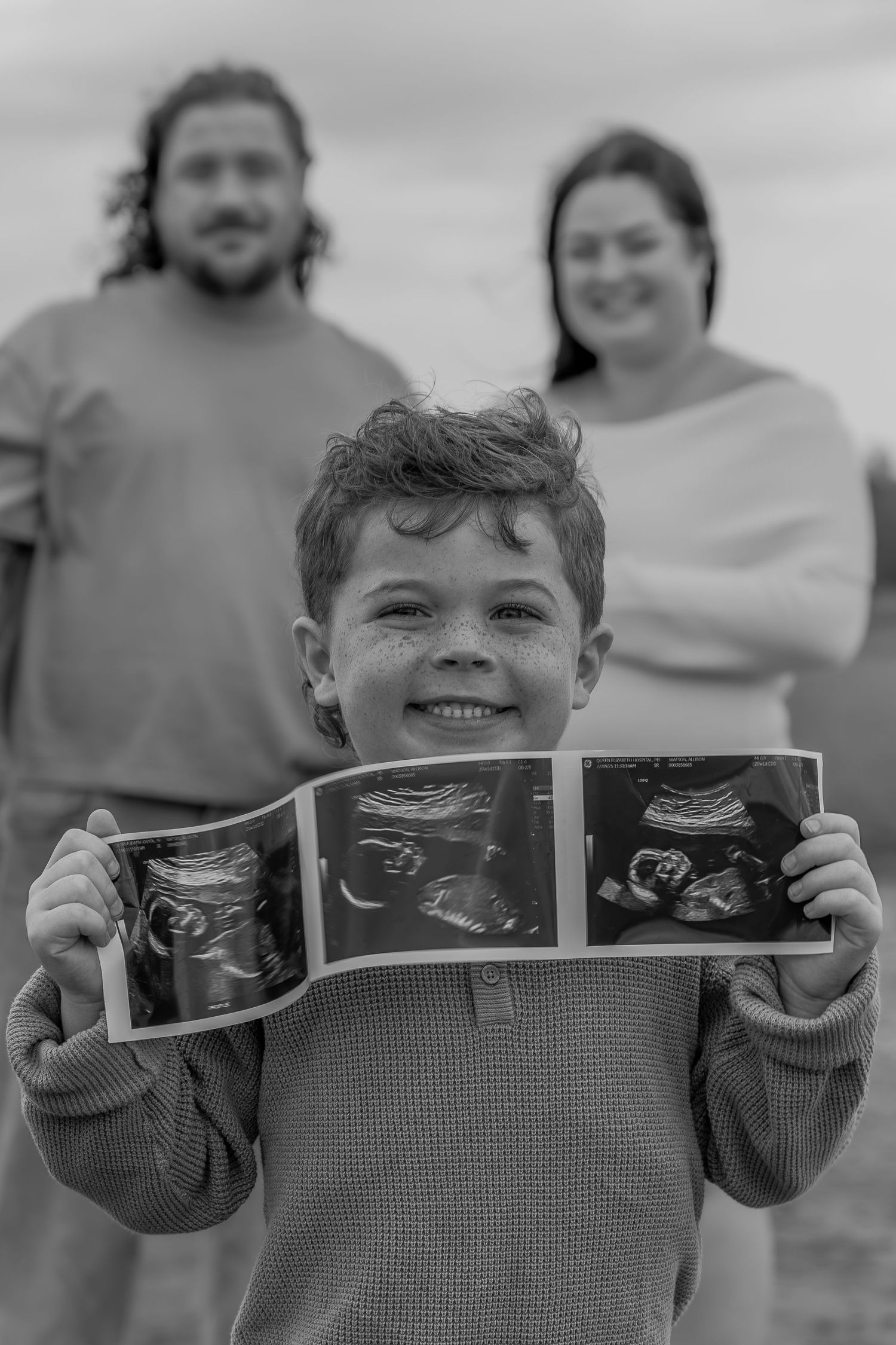 Candid maternity photography on a PEI beach