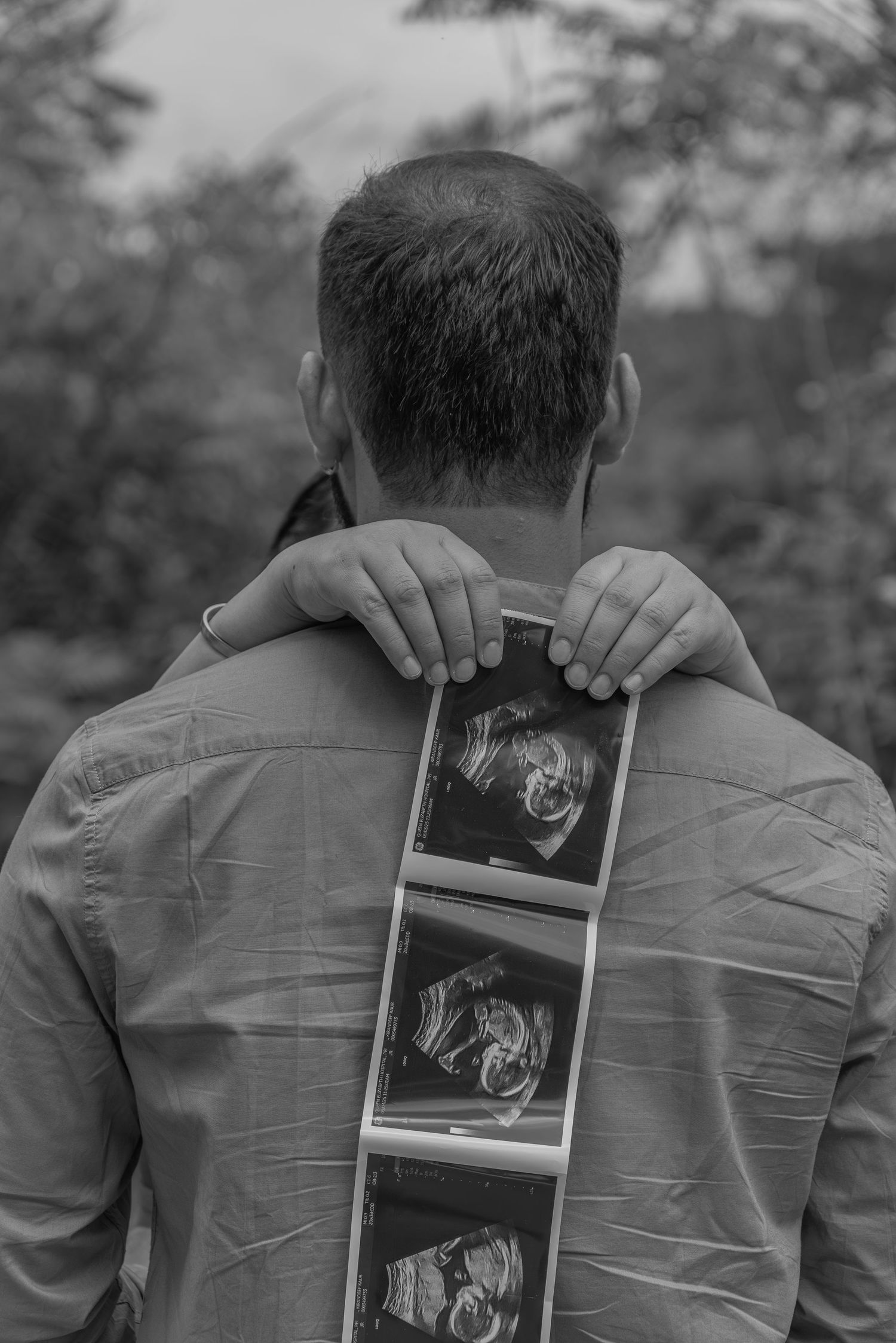 Couple maternity session photographed in a park in PEI