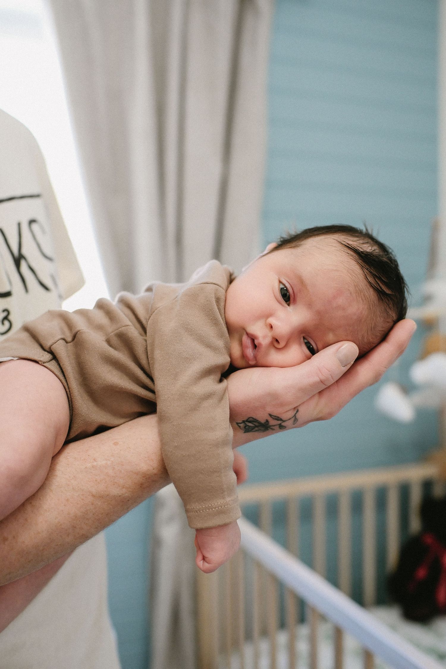 Newborn in in Atlantic Canada captured at home with father.
