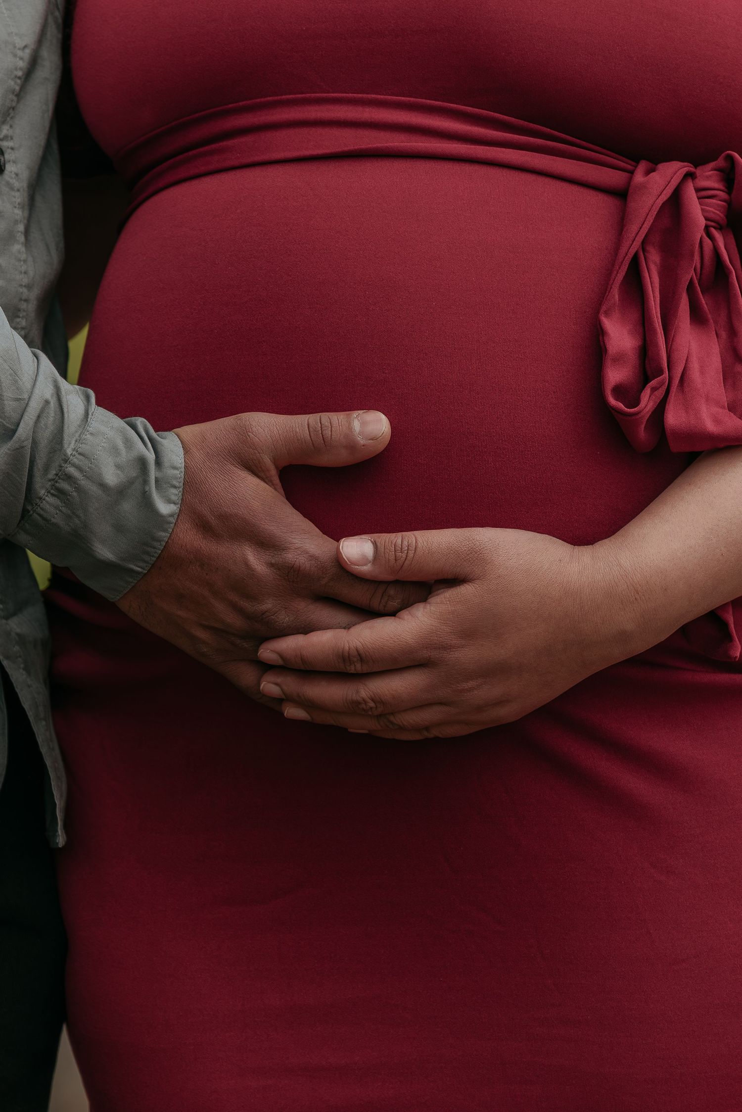 Couple maternity session photographed in a park