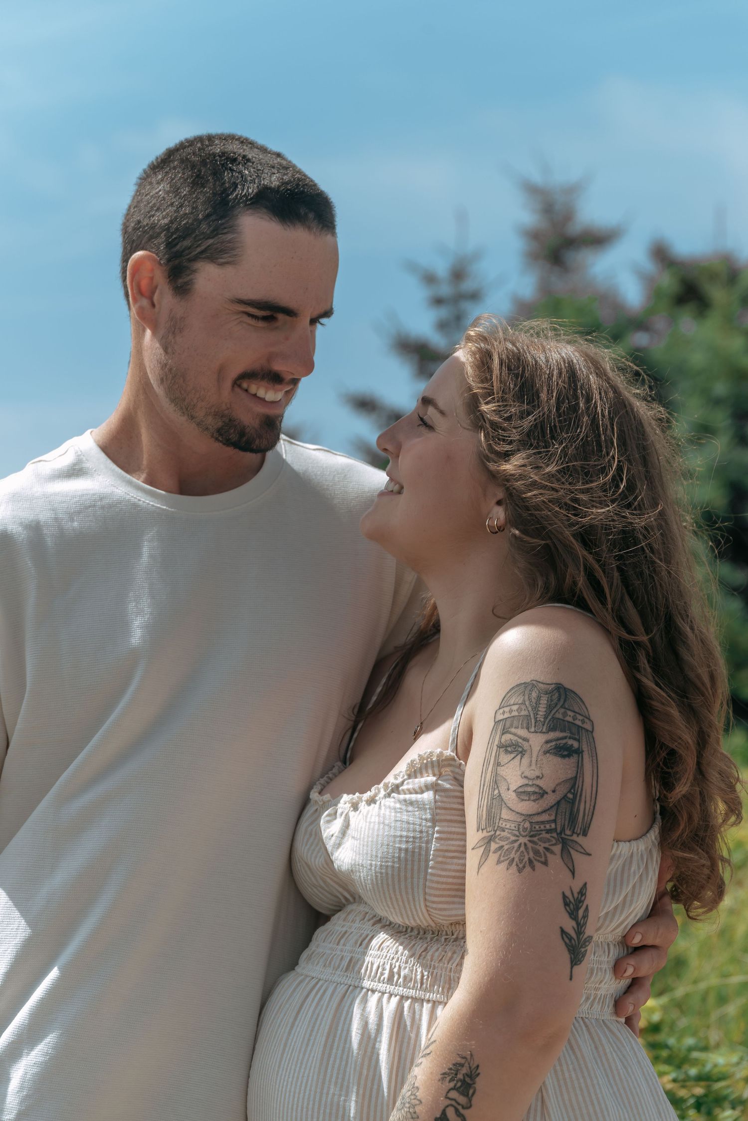 Couple during beach maternity session in NS