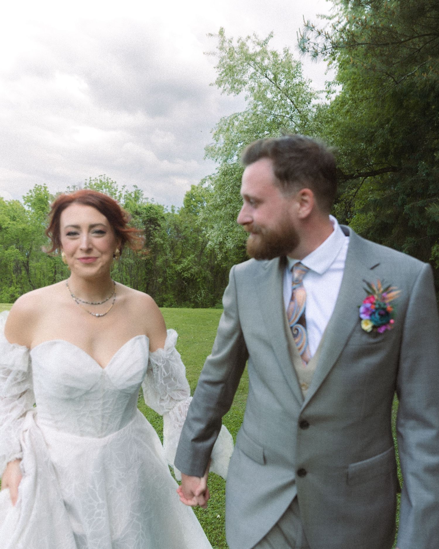 A playful candid outdoor wedding photo sequence showing the couple interacting on a garden path.