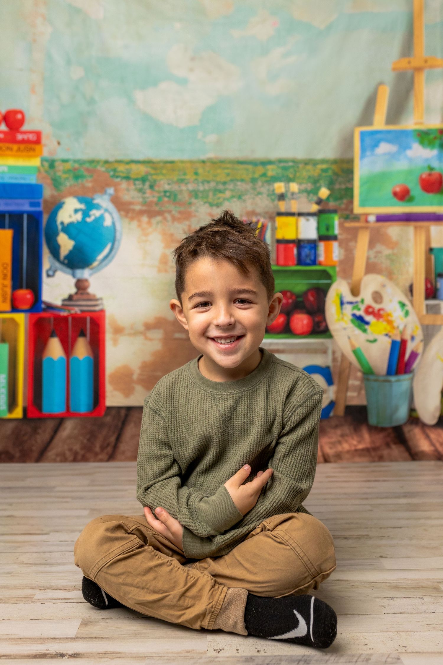 Colorful classroom setting with educational materials, globe, and wooden floor.