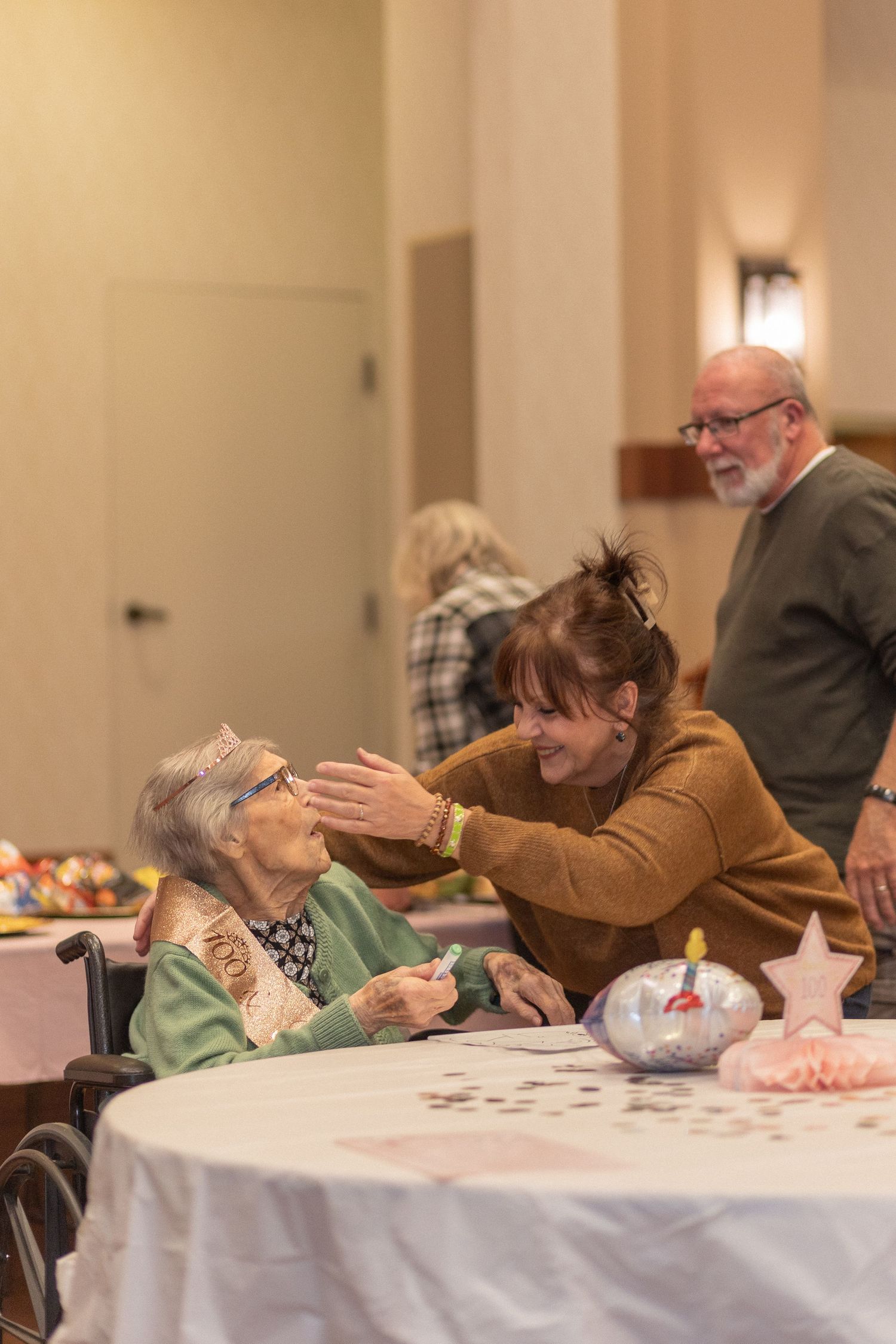 A tender celebratory moment captured during a special gathering.