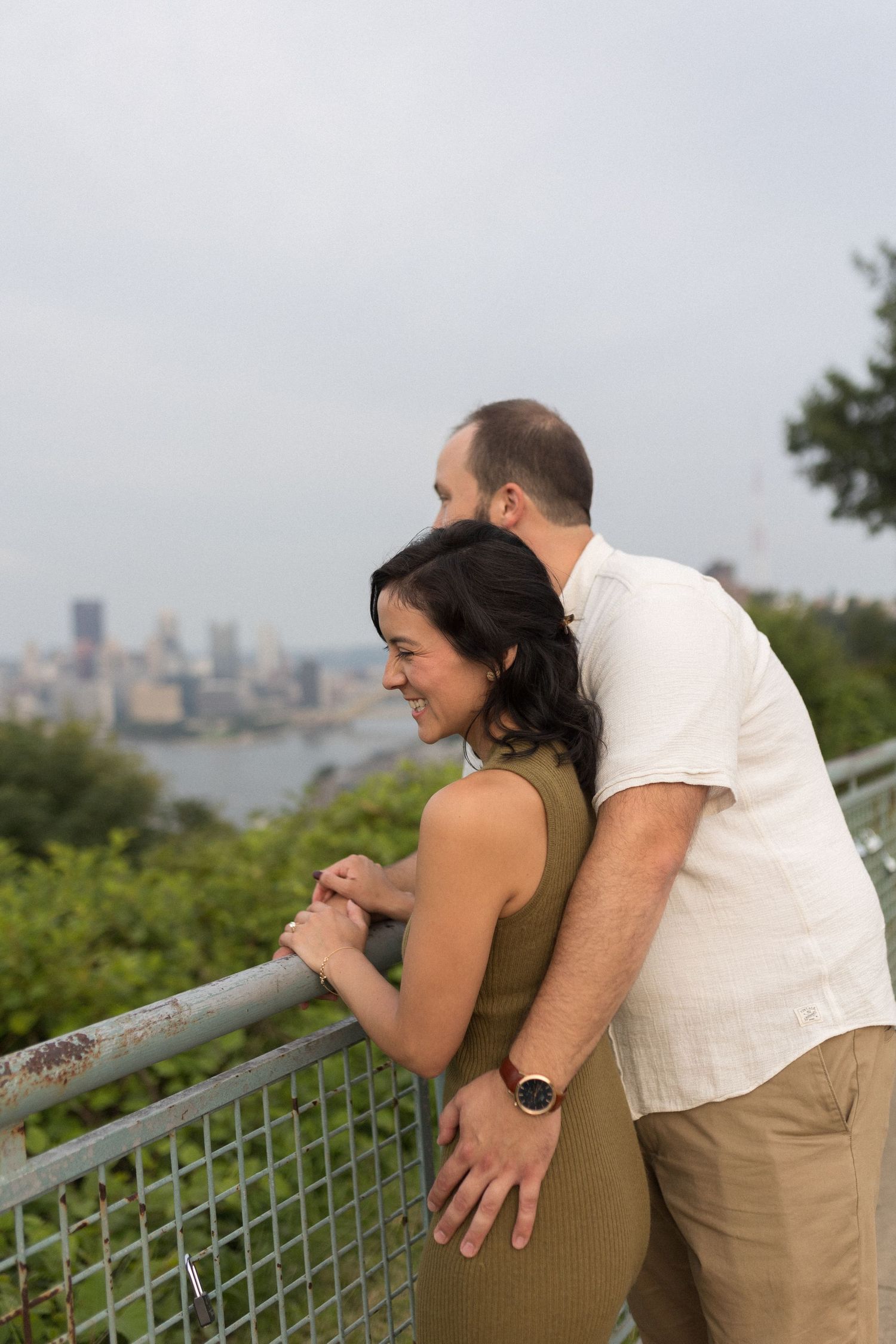 Couple sharing a moment overlooking the city of pittsburgh, candid connection with warm film-inspired editing and natural soft emotion.