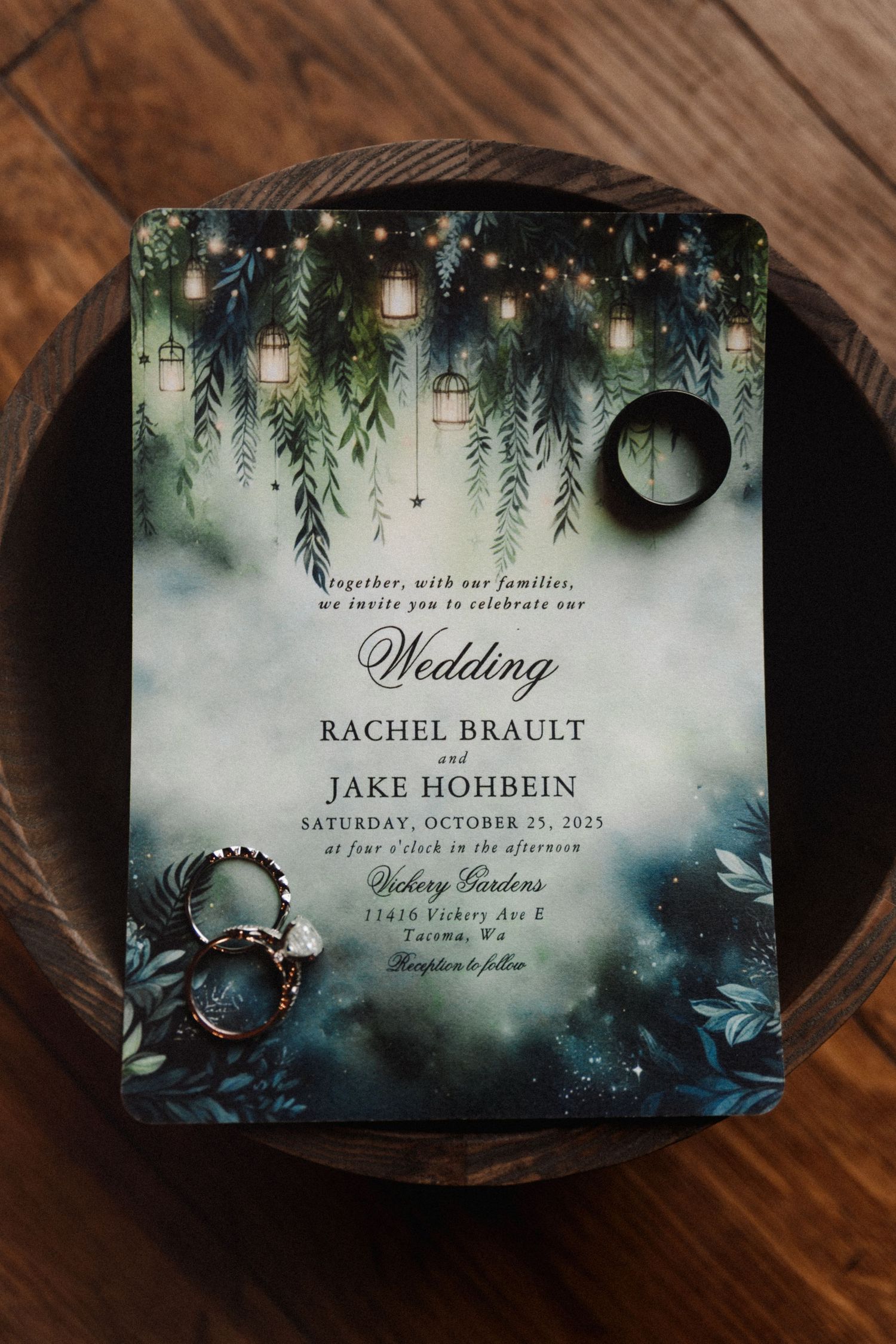 Enchanted forest wedding invitation for Rachel Brault and Jake Hohbein with rings in a wooden bowl.
