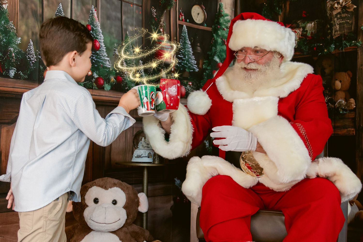 A young boy hands a gift to Santa Claus seated in a festive Christmas setting with sparkling magical effects.