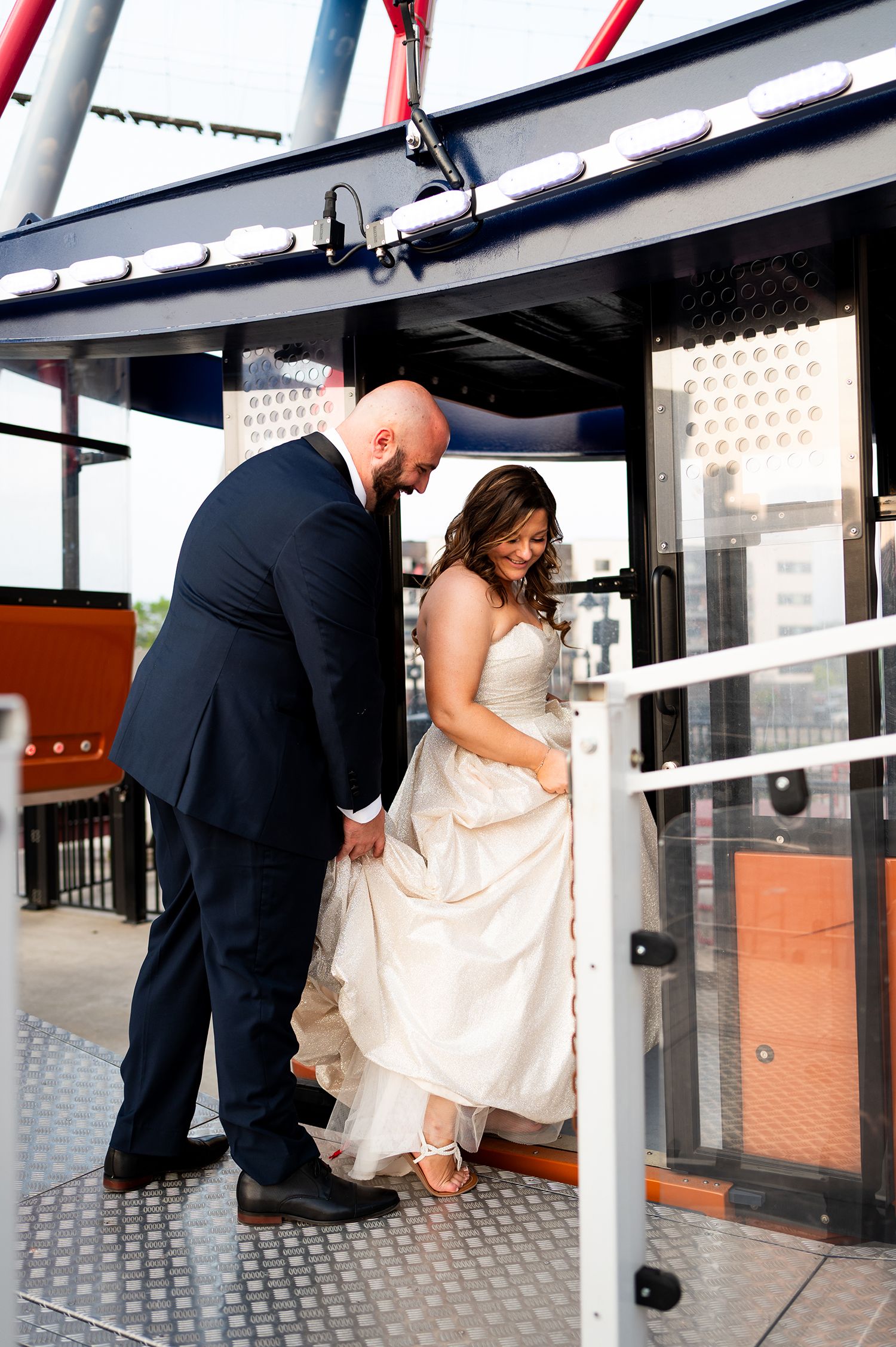 A sequence of photos showing a couple helping each other through a subway turnstile in formal wedding attire.